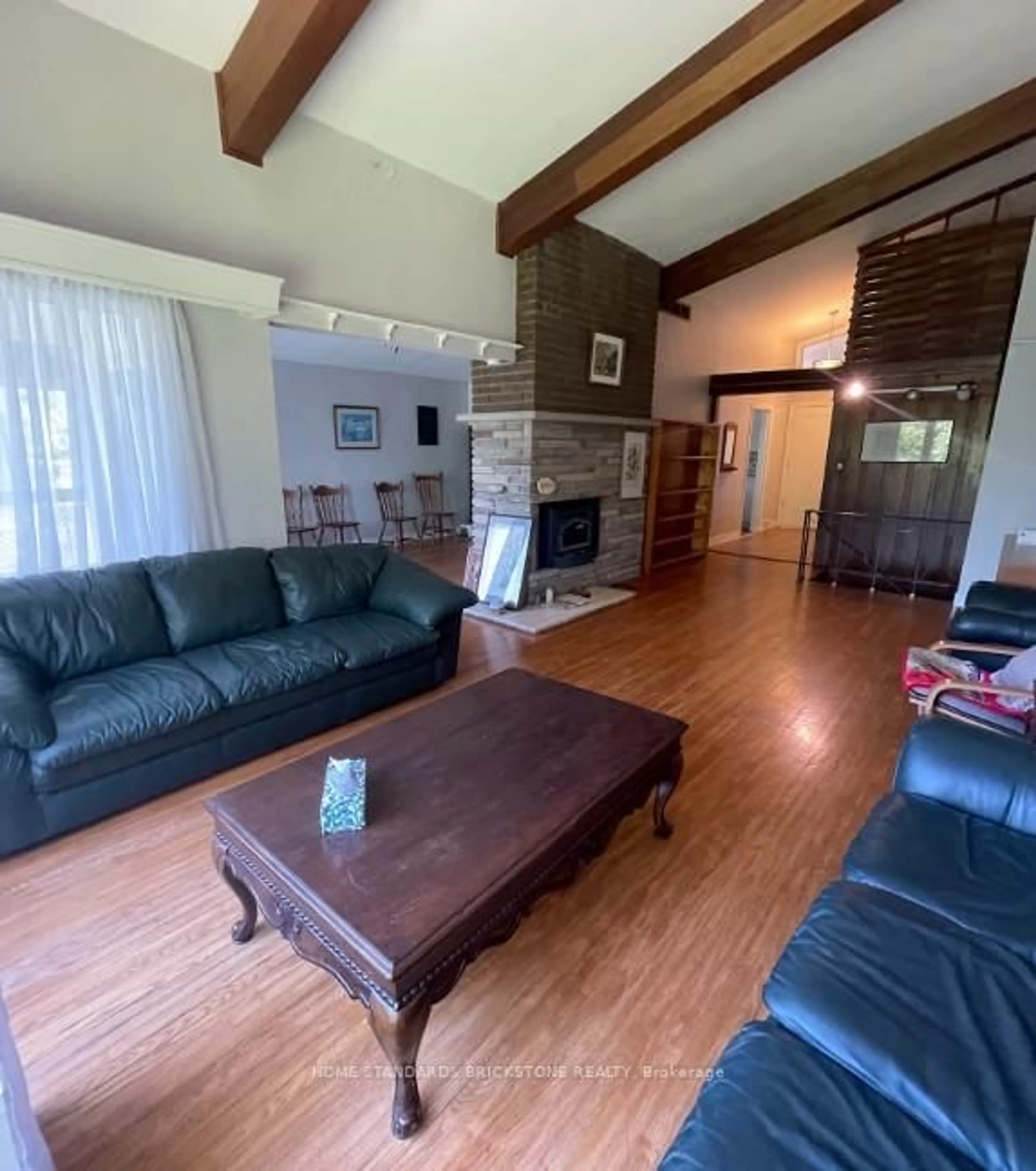Living room with furniture, wood/laminate floor for 72 Mountain Ave, Hamilton Ontario L8G 3P5