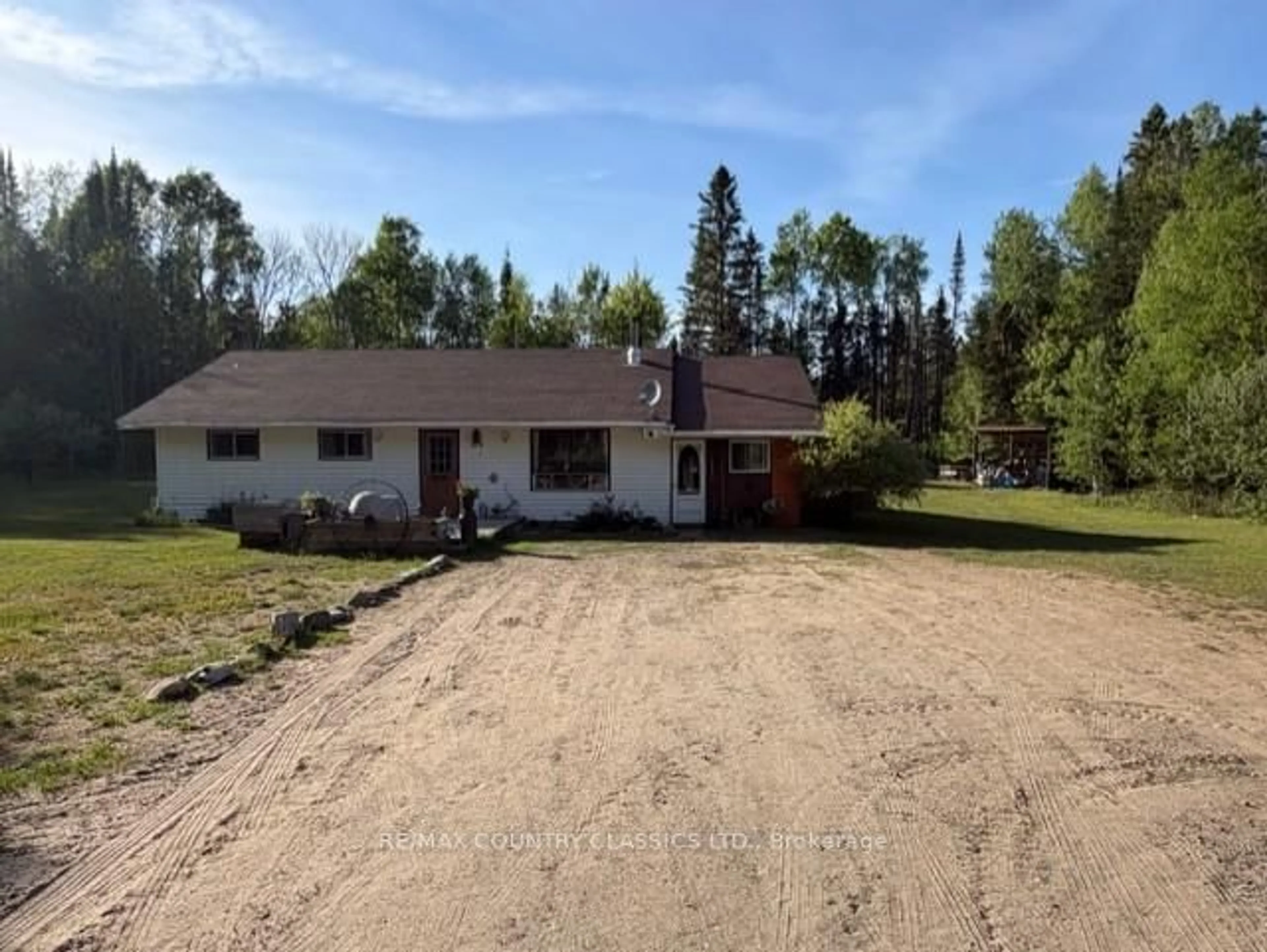 A pic from outside/outdoor area/front of a property/back of a property/a pic from drone, unknown for 319 East Lake Rd, Maynooth Ontario K0L 2S0