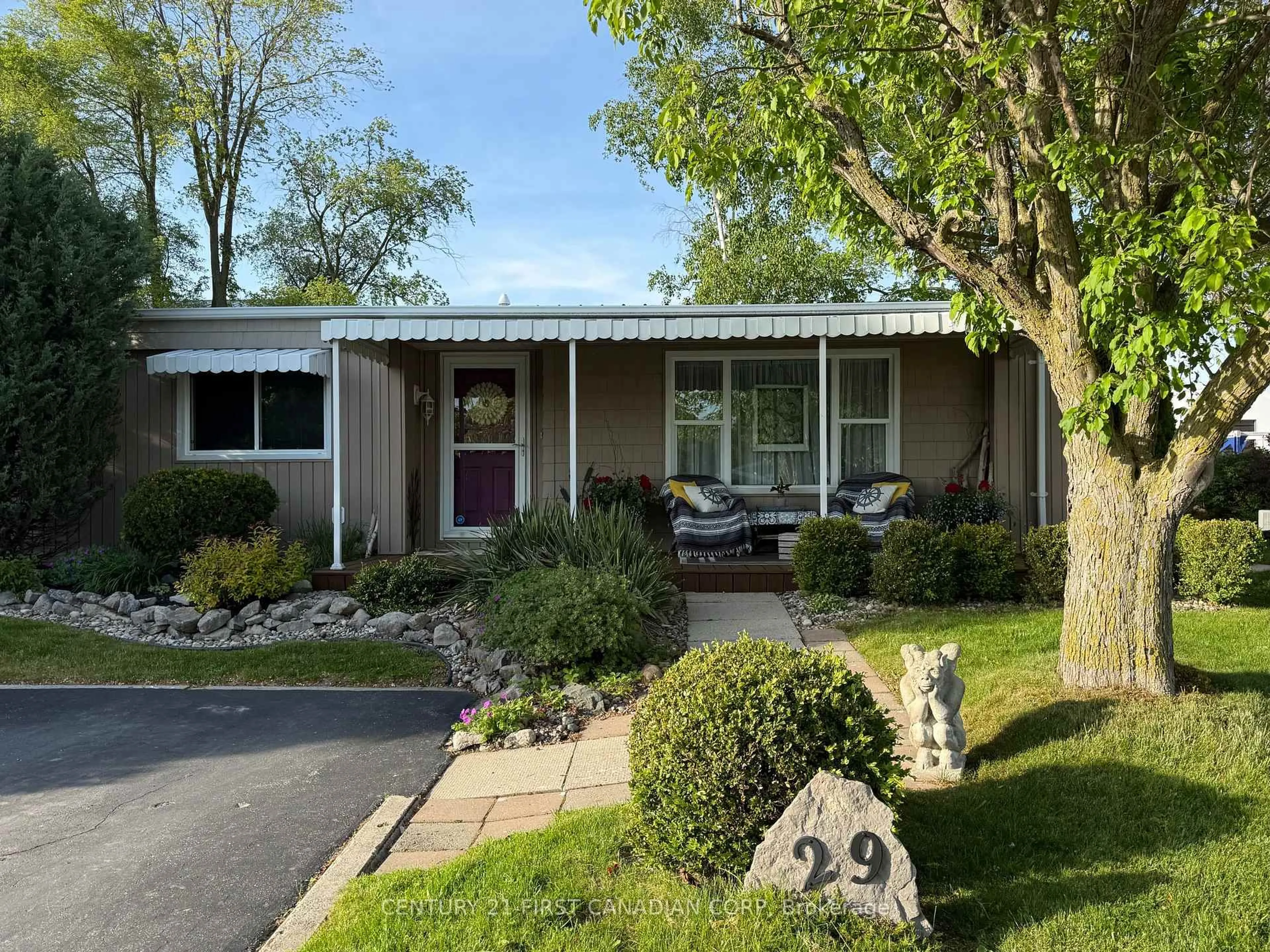 Home with vinyl exterior material, street for 29 Maple Grove Crt, South Huron Ontario N0M 1T0