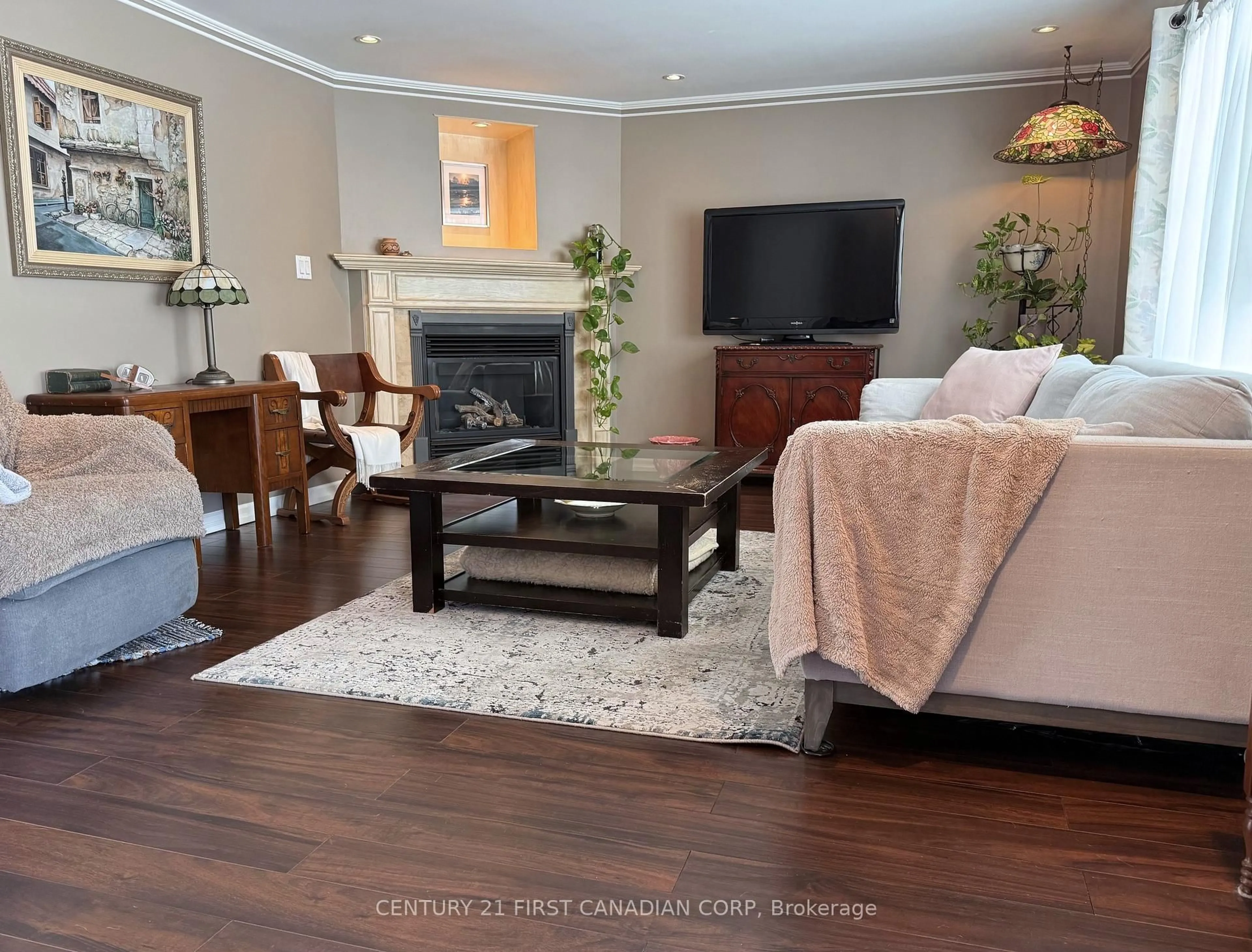 Living room with furniture, wood/laminate floor for 29 Maple Grove Crt, South Huron Ontario N0M 1T0
