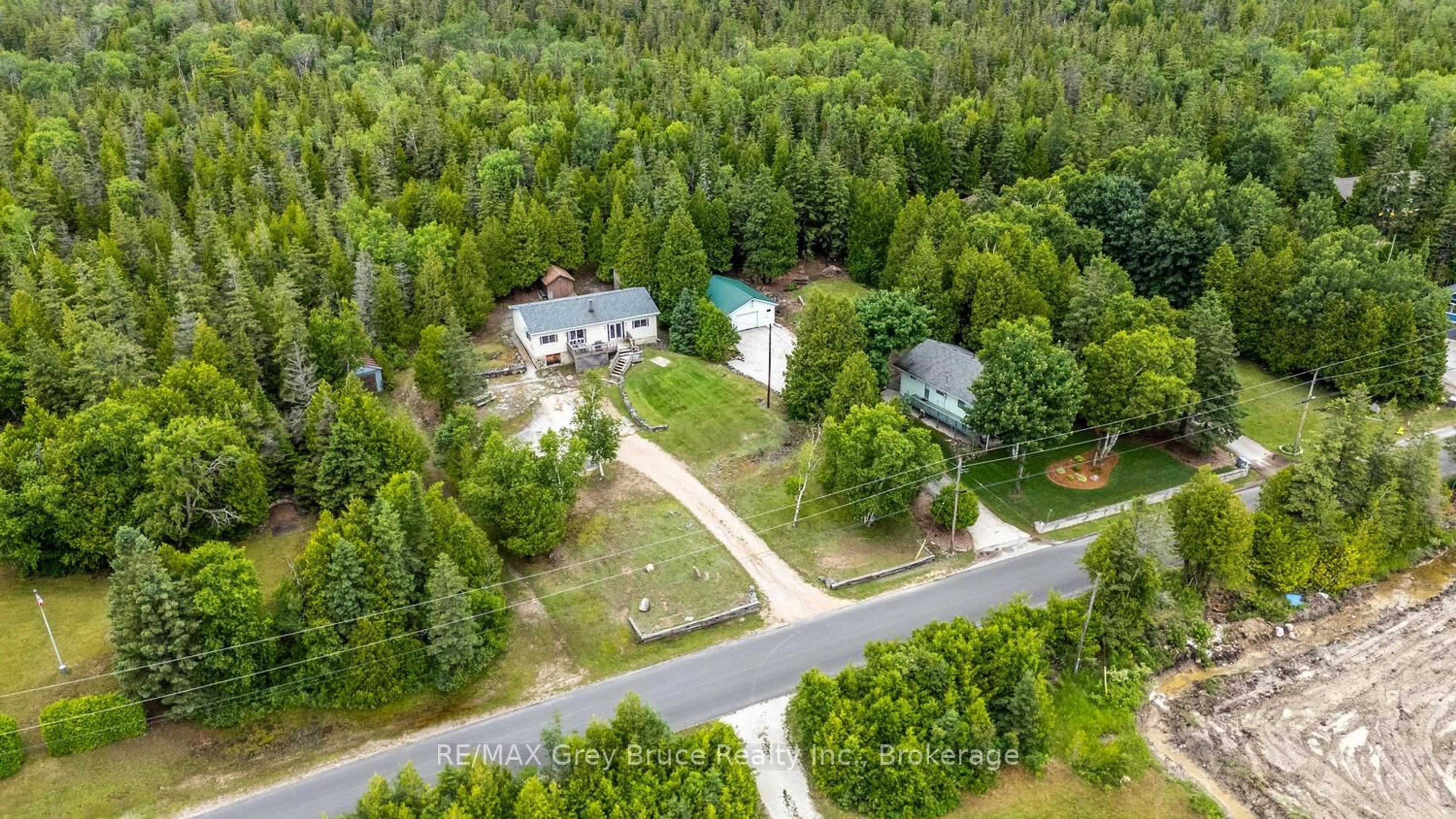 A pic from outside/outdoor area/front of a property/back of a property/a pic from drone, forest/trees view for 68 Tamarac Rd, Northern Bruce Peninsula Ontario N0H 2M0