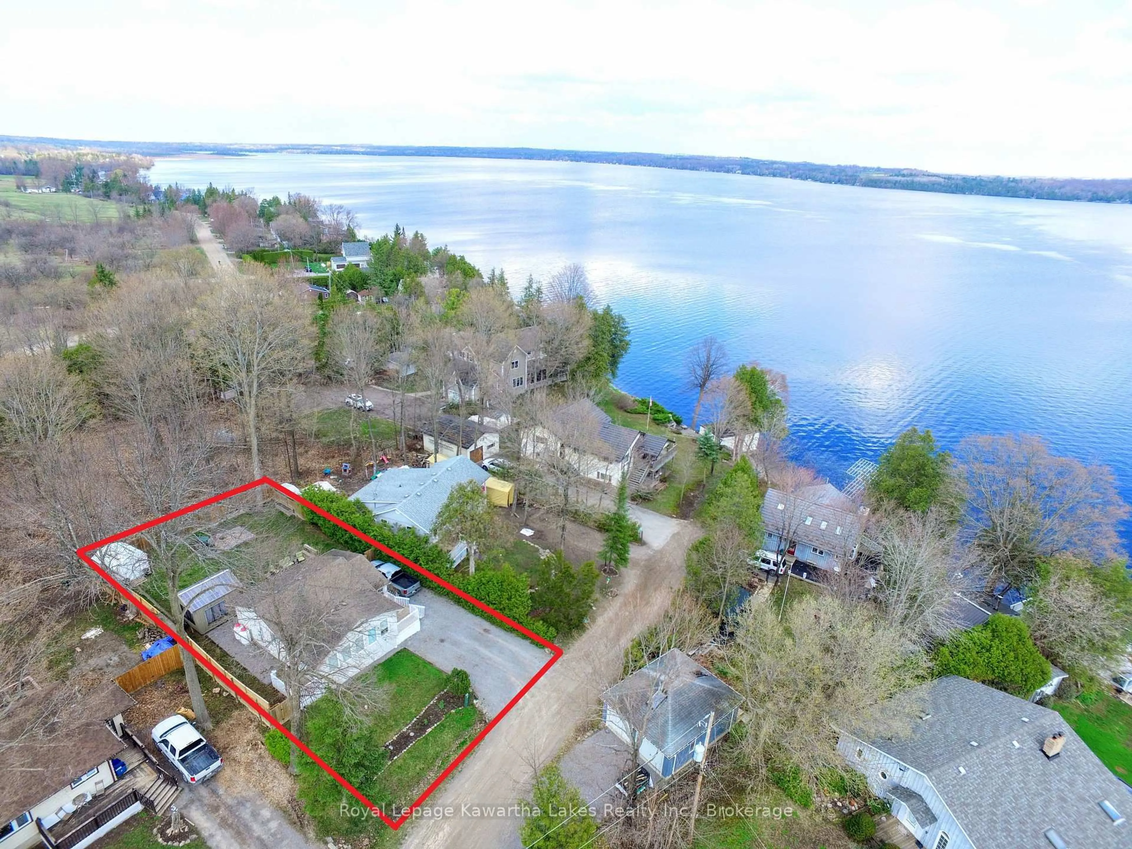 A pic from outside/outdoor area/front of a property/back of a property/a pic from drone, water/lake/river/ocean view for 21 Pleasure St, Kawartha Lakes Ontario K0M 1G0