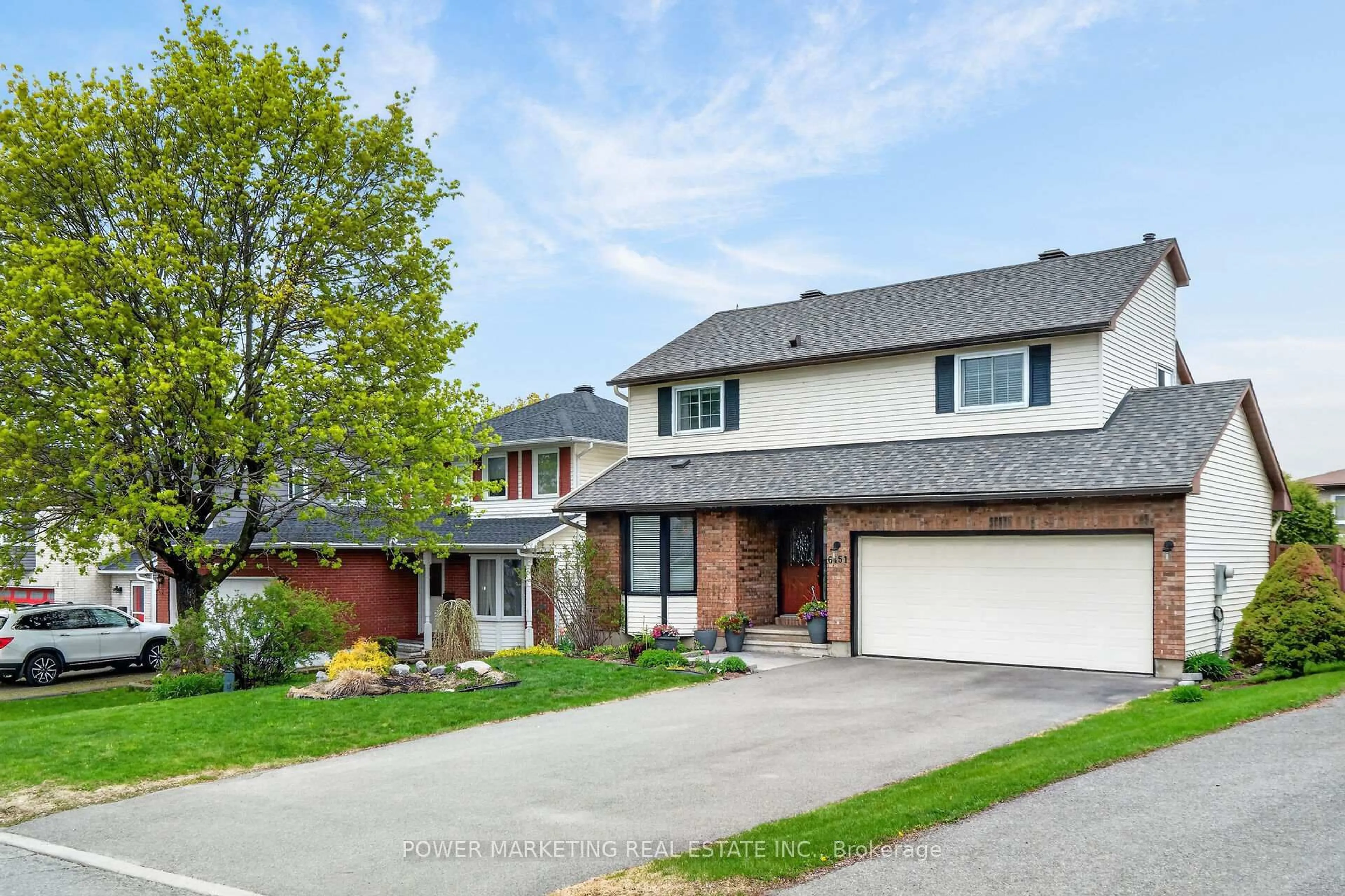 Home with brick exterior material, street for 6451 VISENEAU Dr, Orleans Ontario K1C 5H1