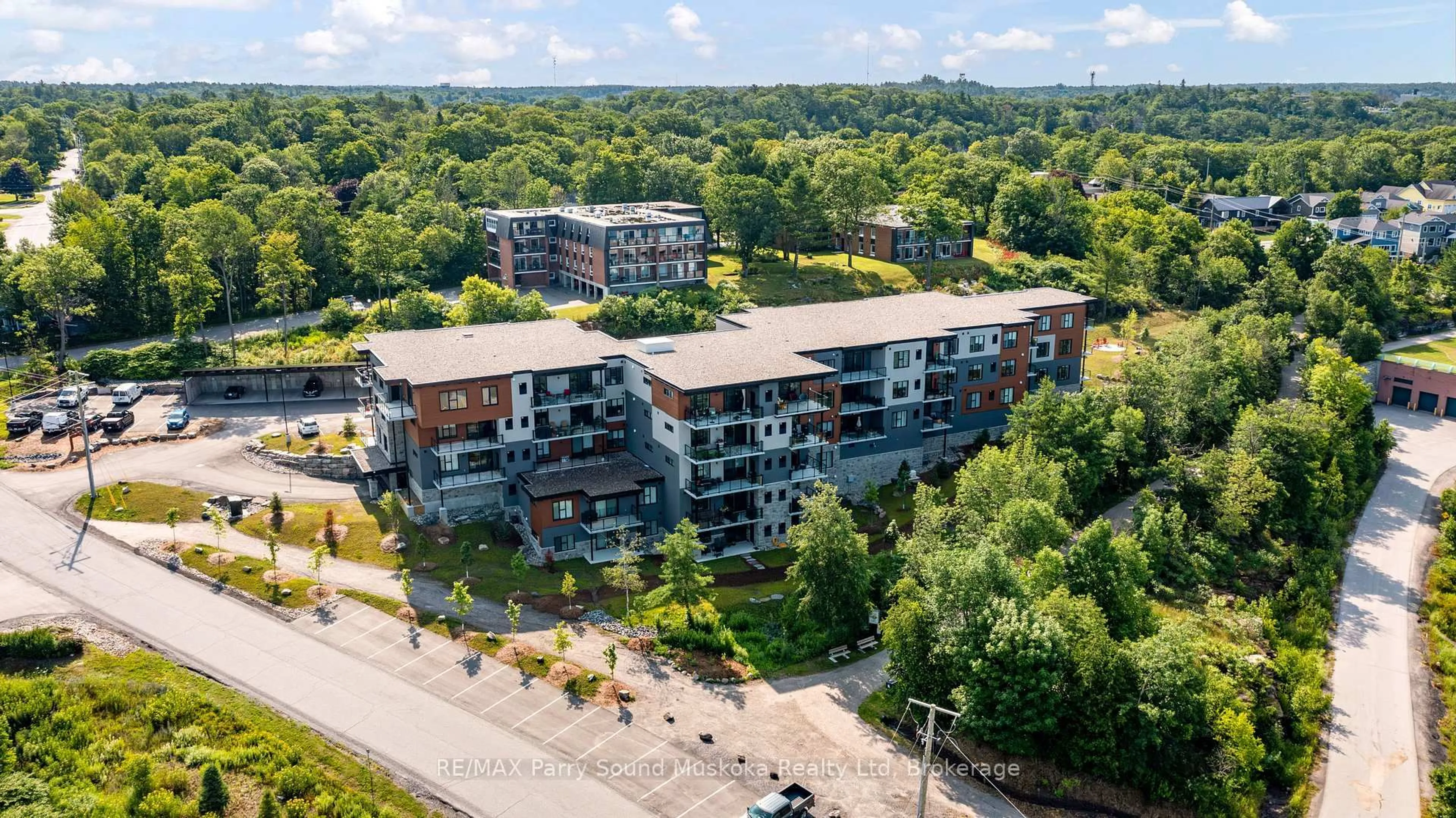 A pic from outside/outdoor area/front of a property/back of a property/a pic from drone, city buildings view from balcony for 20 Salt Dock Rd #105, Parry Sound Ontario P2A 0E7