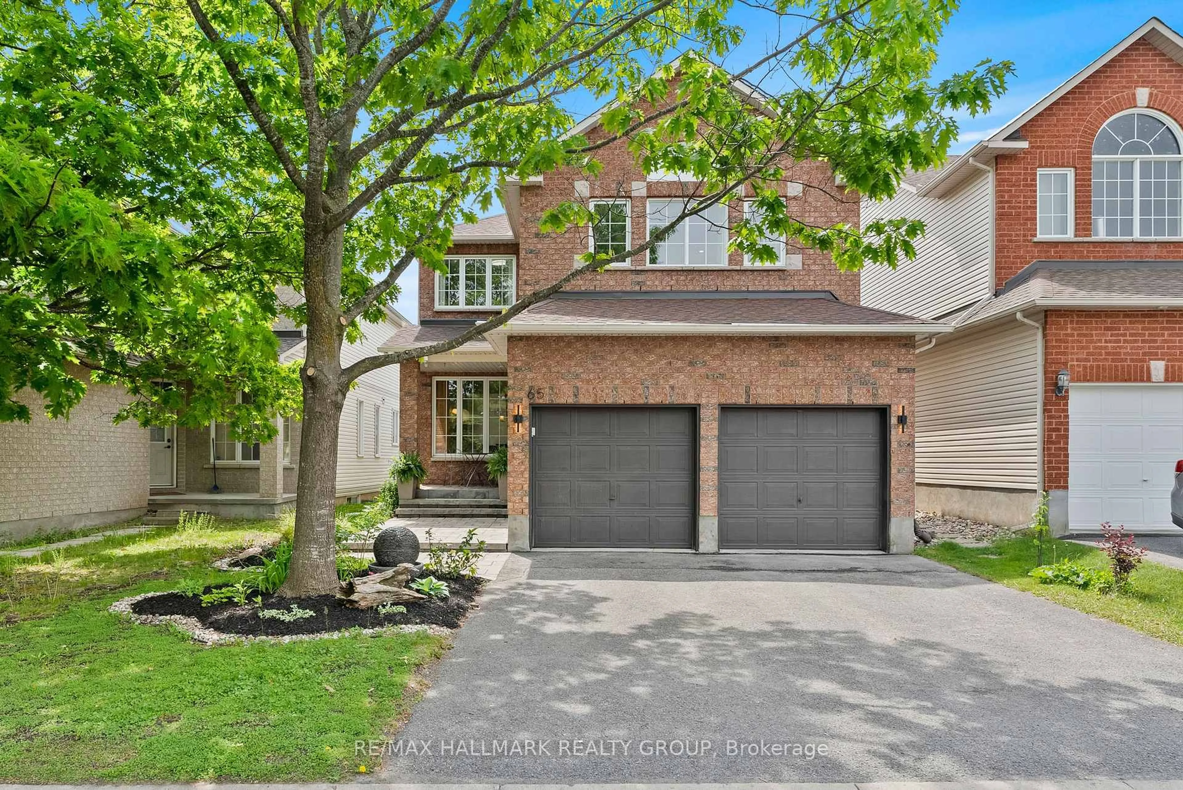 Home with brick exterior material, street for 65 Alameda Way, Ottawa Ontario K2J 5B3