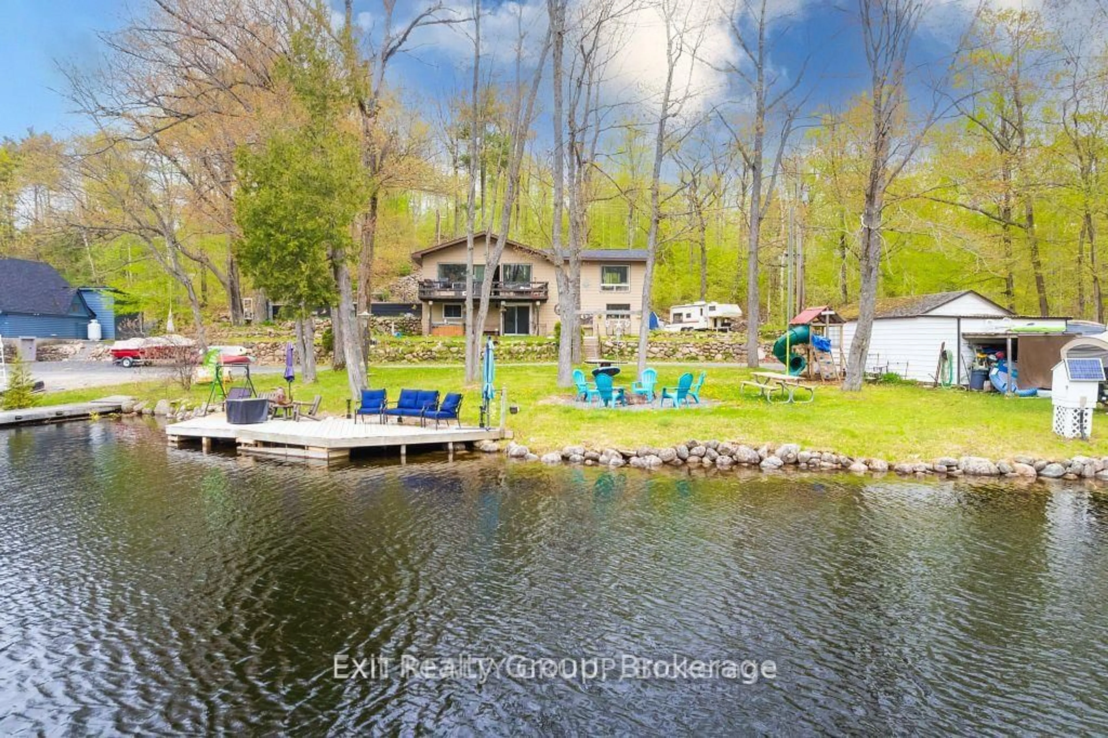 A pic from outside/outdoor area/front of a property/back of a property/a pic from drone, water/lake/river/ocean view for 1058 Wellman Rd, Cloyne Ontario K0H 1K0