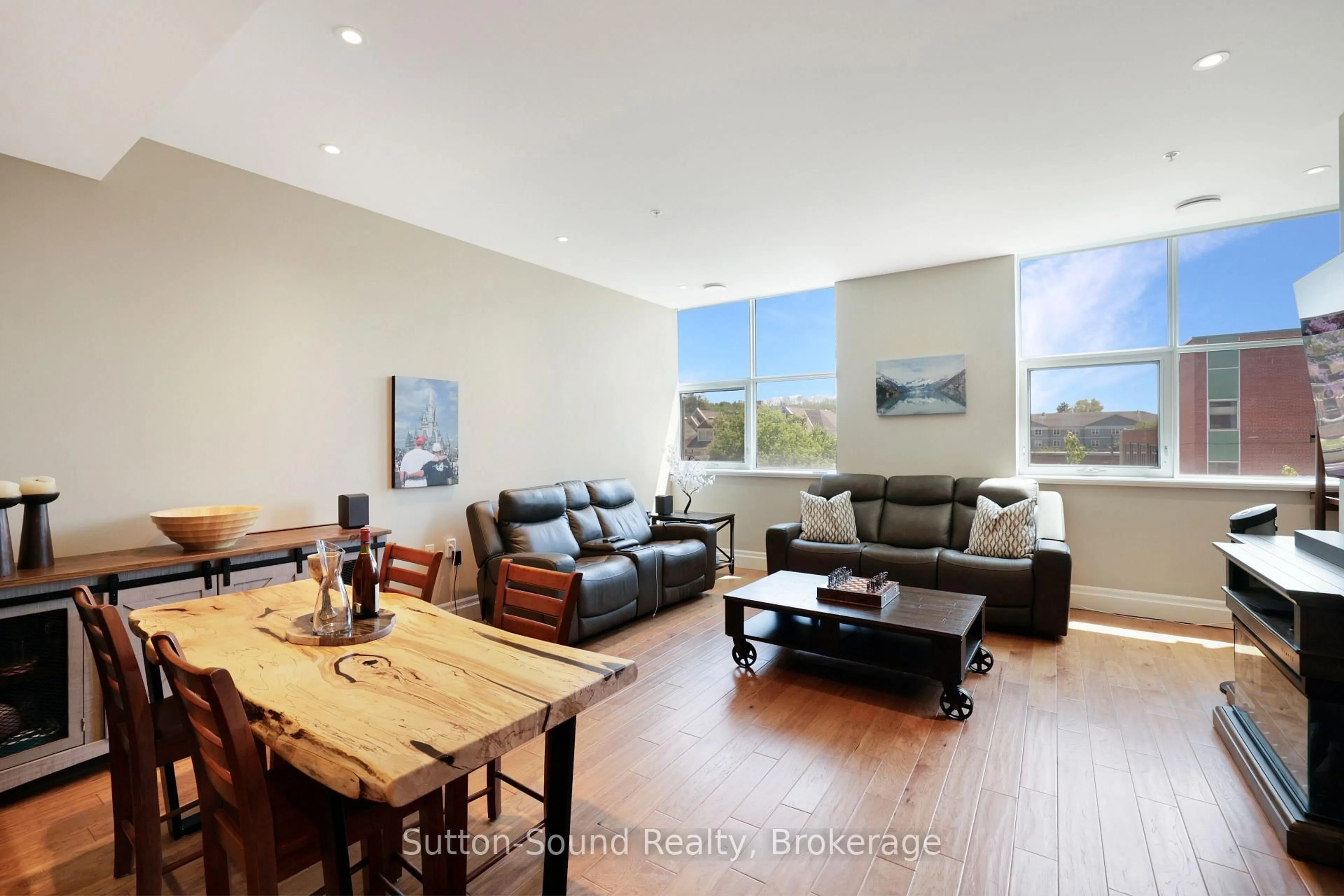 Living room with furniture, wood/laminate floor for 945 3rd Ave #303, Owen Sound Ontario N4K 2K8