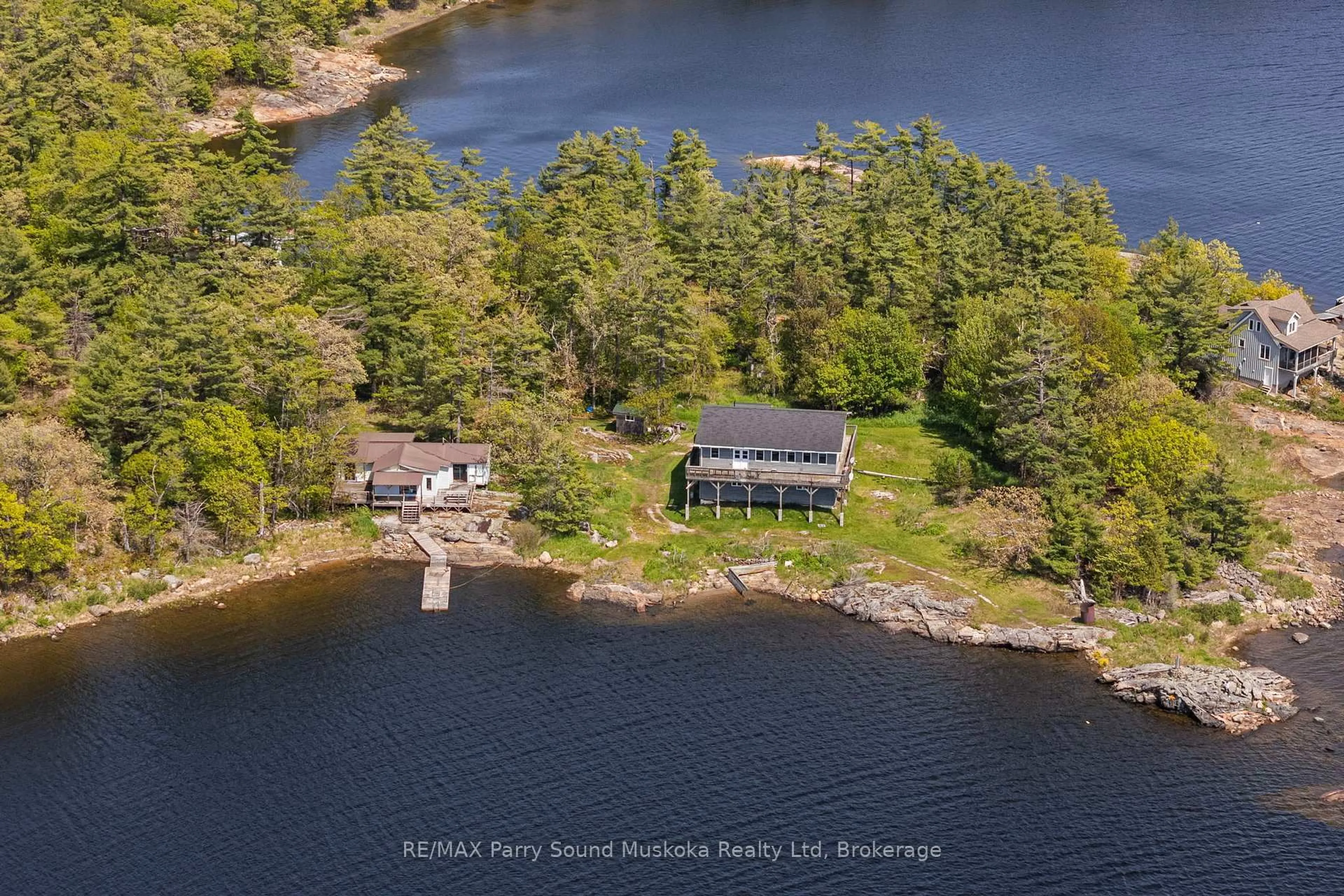 A pic from outside/outdoor area/front of a property/back of a property/a pic from drone, water/lake/river/ocean view for 16 B55 Island Island, The Archipelago Ontario P0C 1H0