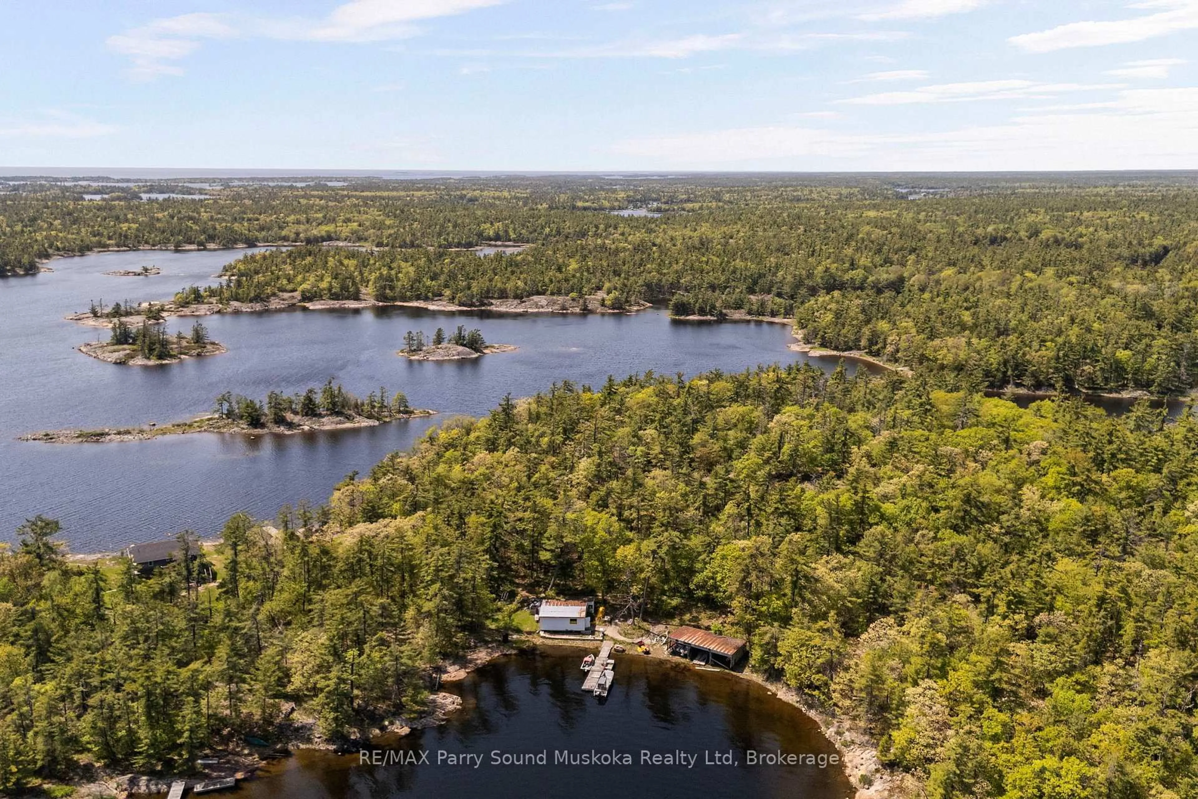 A pic from outside/outdoor area/front of a property/back of a property/a pic from drone, water/lake/river/ocean view for 16 B55 Island Island, The Archipelago Ontario P0C 1H0