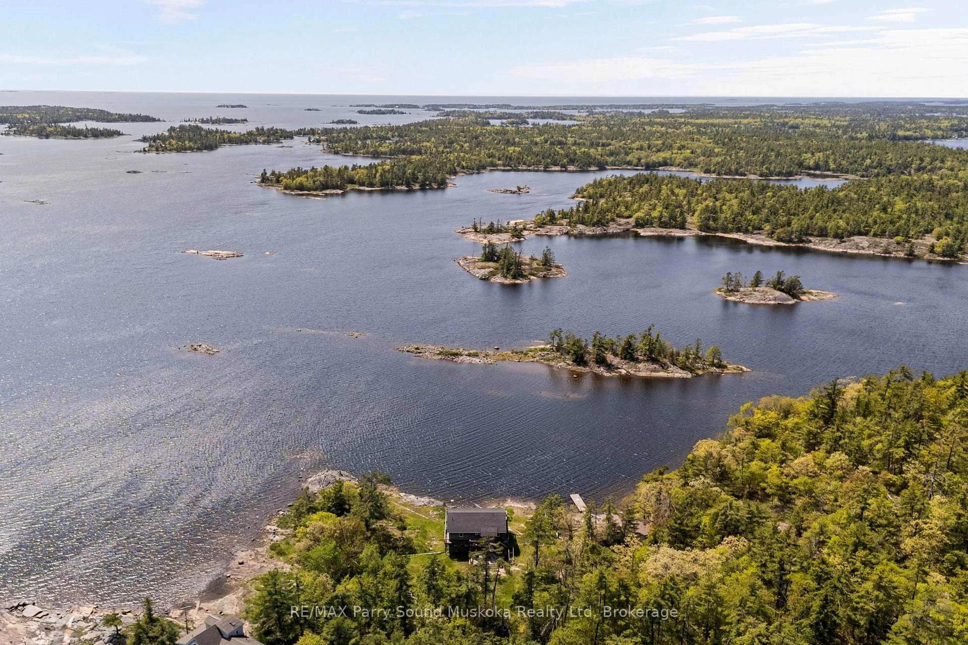 A pic from outside/outdoor area/front of a property/back of a property/a pic from drone, water/lake/river/ocean view for 16 B55 Island Island, The Archipelago Ontario P0C 1H0