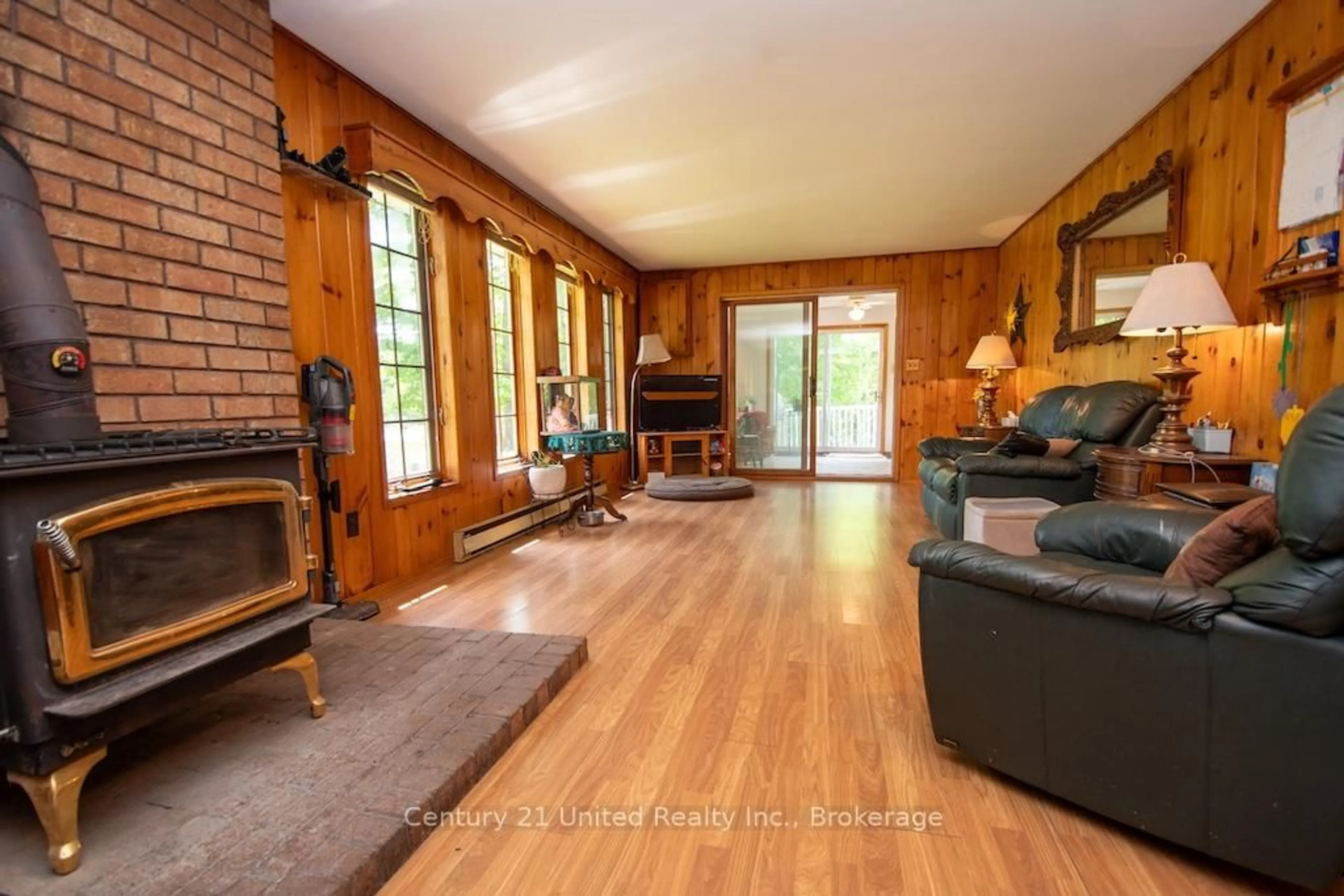 Living room with furniture, wood/laminate floor for 254 County Rd 620, North Kawartha Ontario K0L 1A0