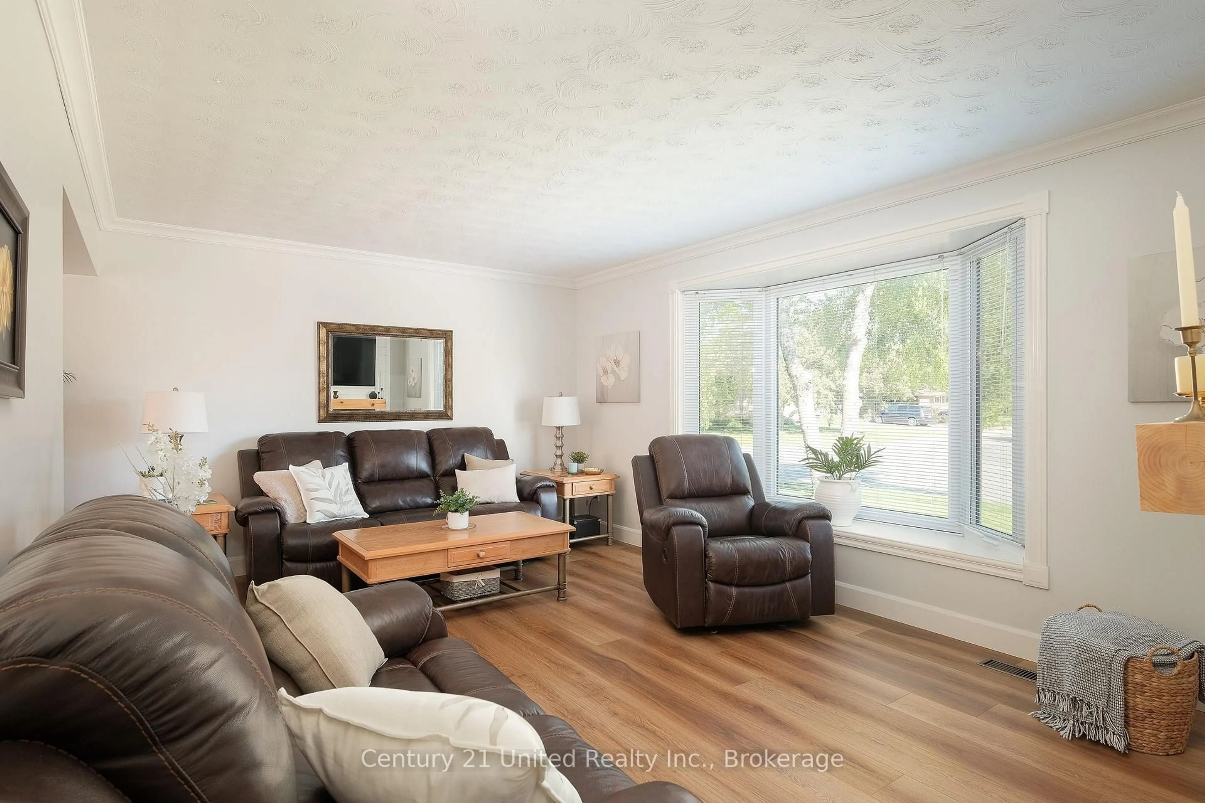 Living room with furniture, wood/laminate floor for 1233 Franklin Dr, Peterborough Ontario K9H 6Z3