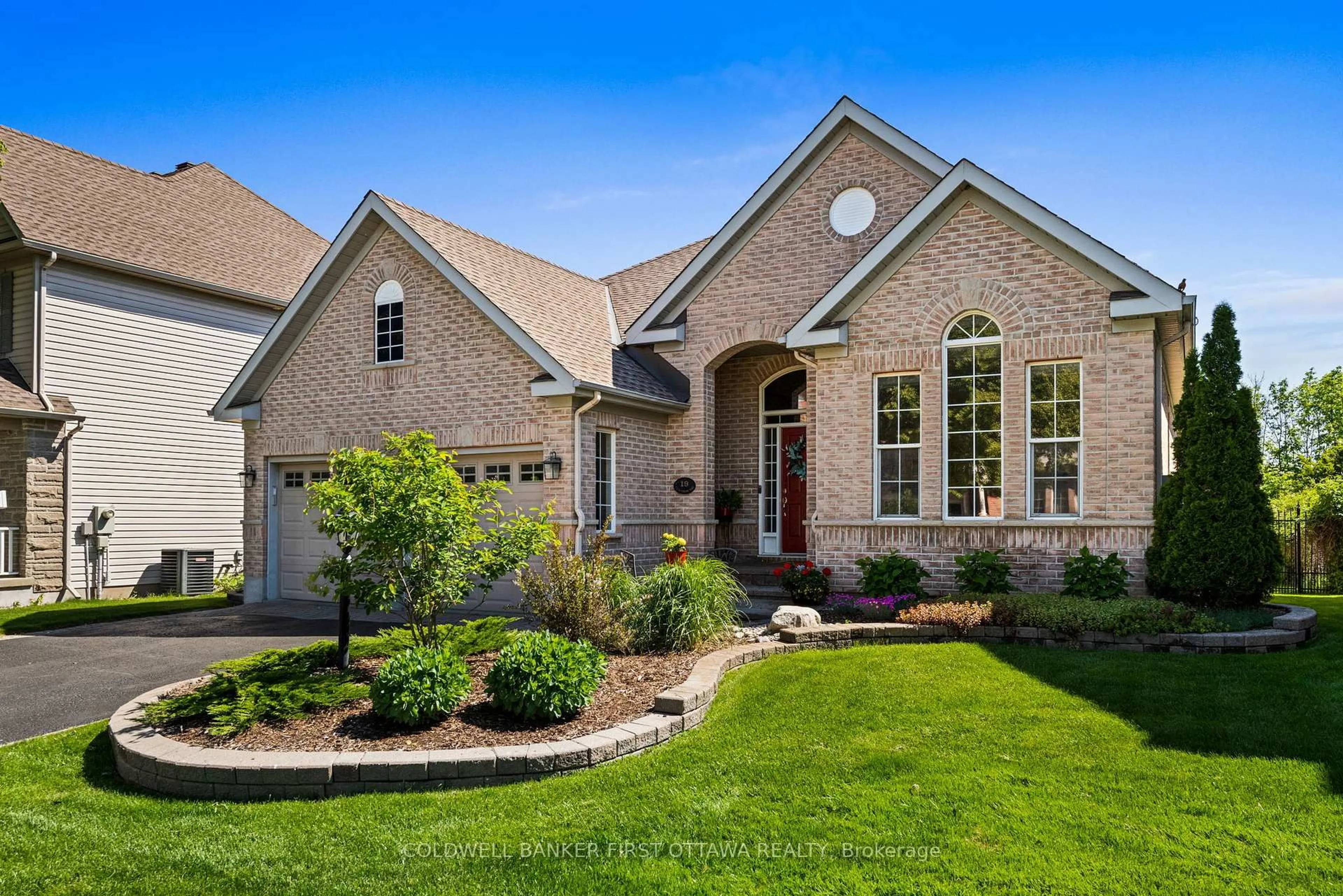 Home with brick exterior material, street for 19 Fencerow Way, Nepean Ontario K2J 4X8