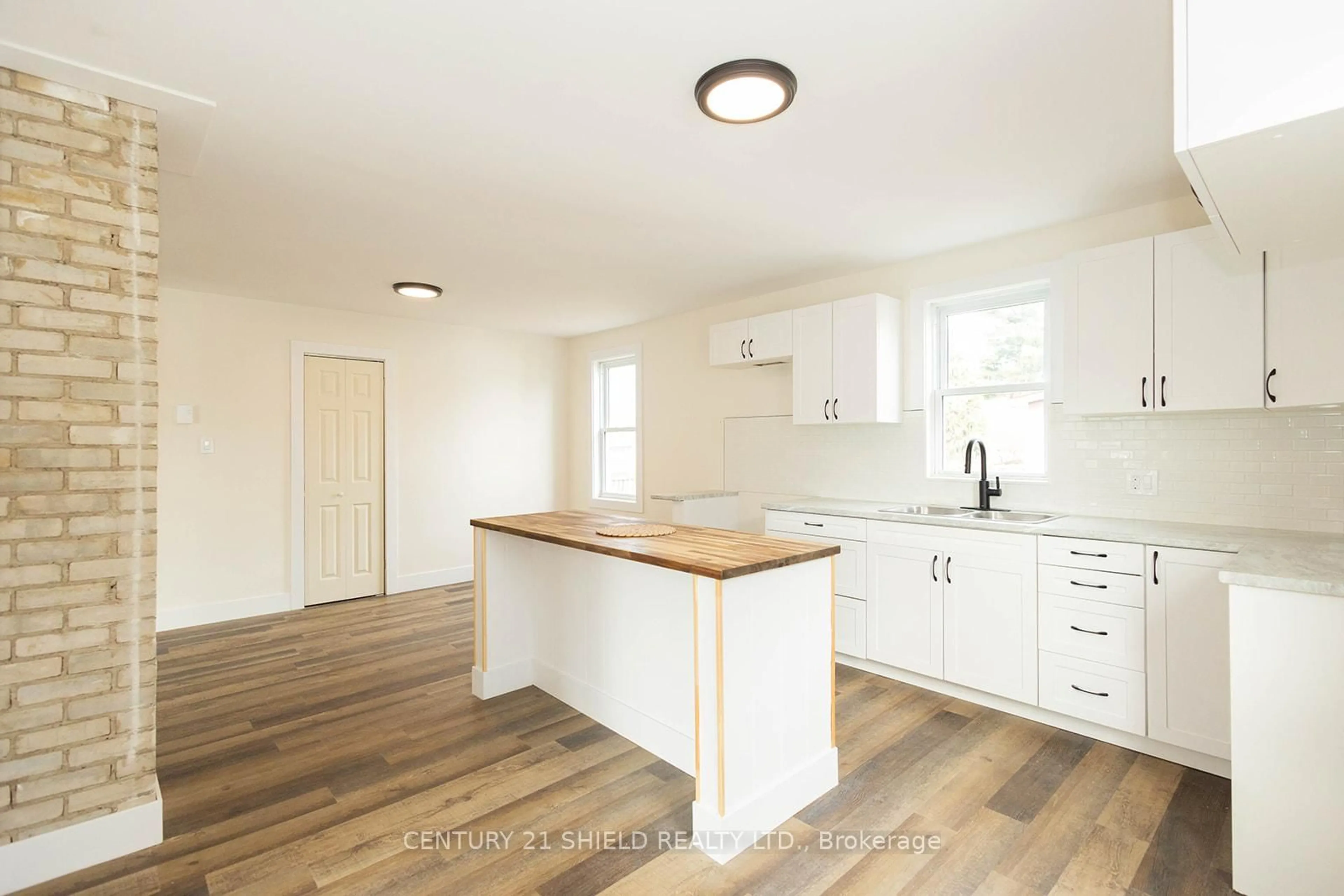 Open concept kitchen, wood/laminate floor for 1008 Second Street E. St, Cornwall Ontario K6H 2A9