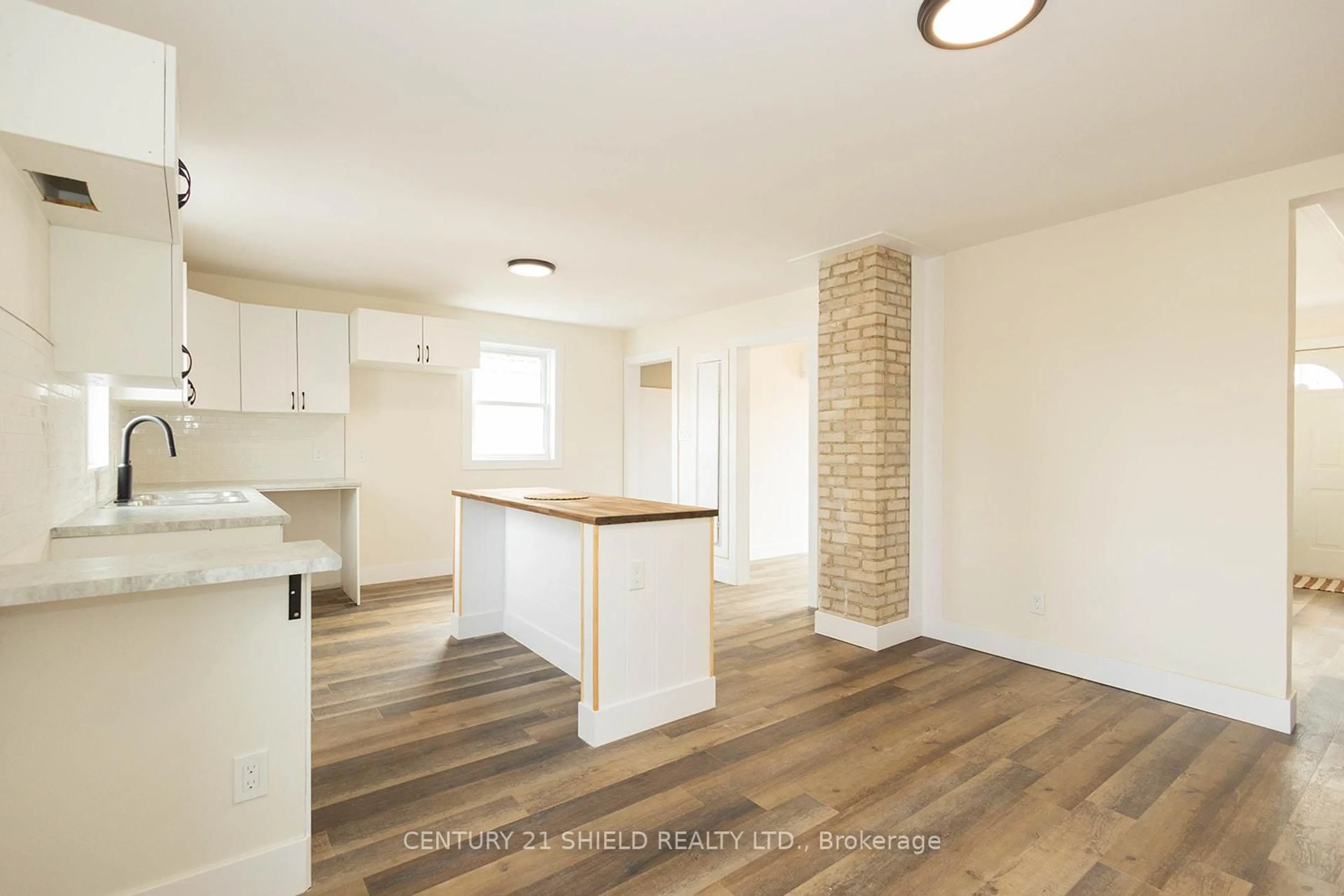 Open concept kitchen, wood/laminate floor for 1008 Second Street E. St, Cornwall Ontario K6H 2A9