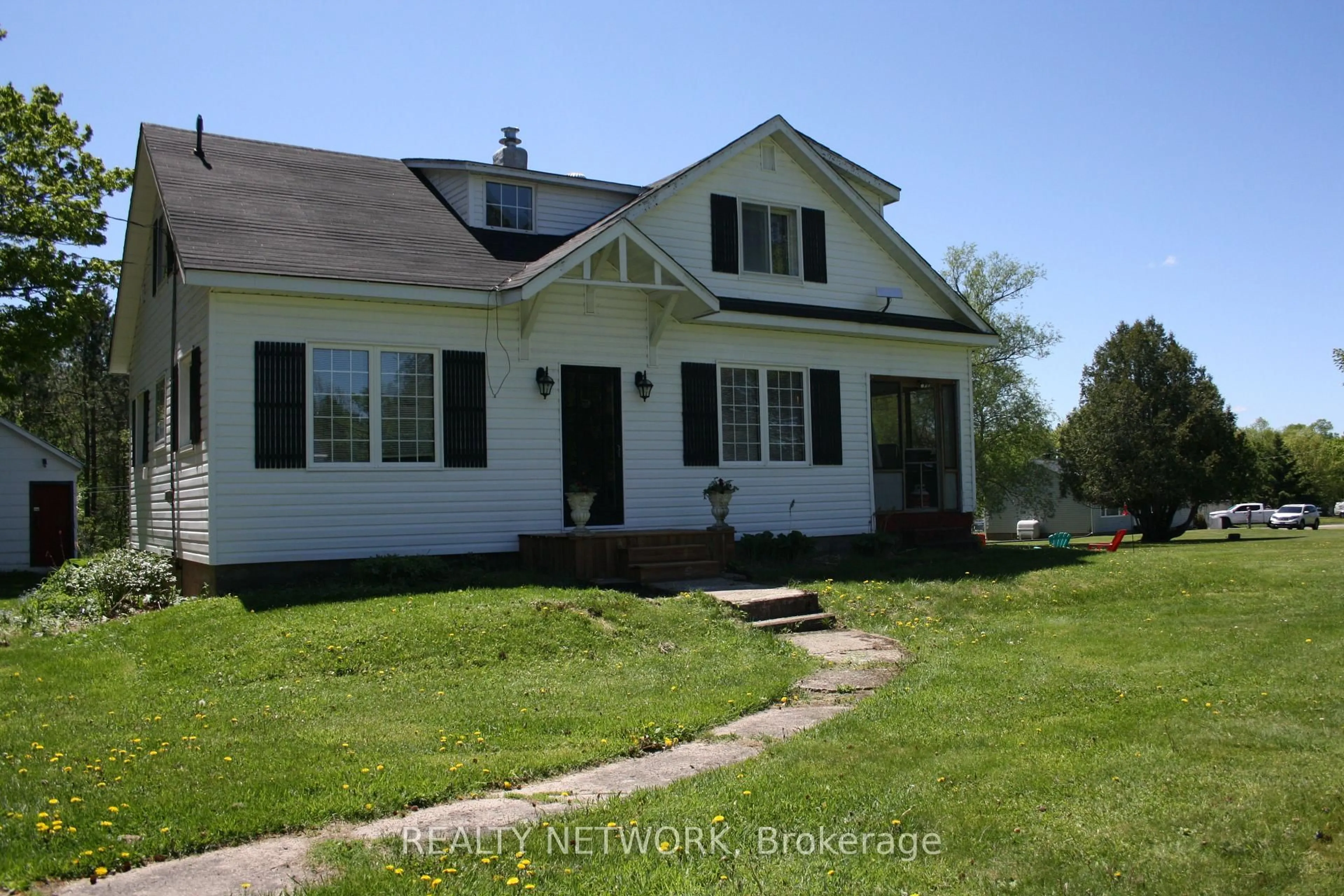 A pic from outside/outdoor area/front of a property/back of a property/a pic from drone, street for 11519 522 Highway, Parry Sound Remote Area Ontario P0H 1Y0