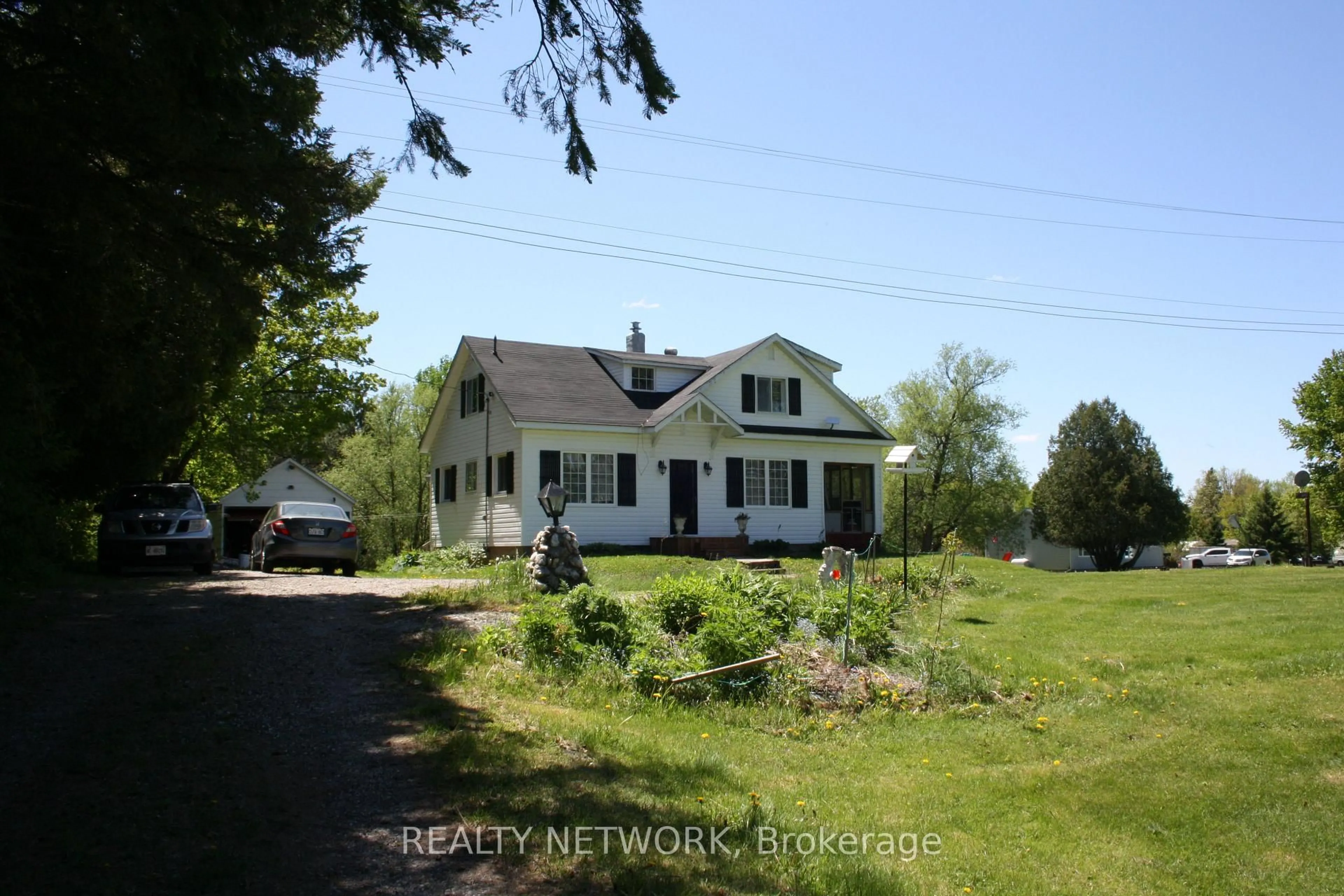 A pic from outside/outdoor area/front of a property/back of a property/a pic from drone, water/lake/river/ocean view for 11519 522 Highway, Parry Sound Remote Area Ontario P0H 1Y0