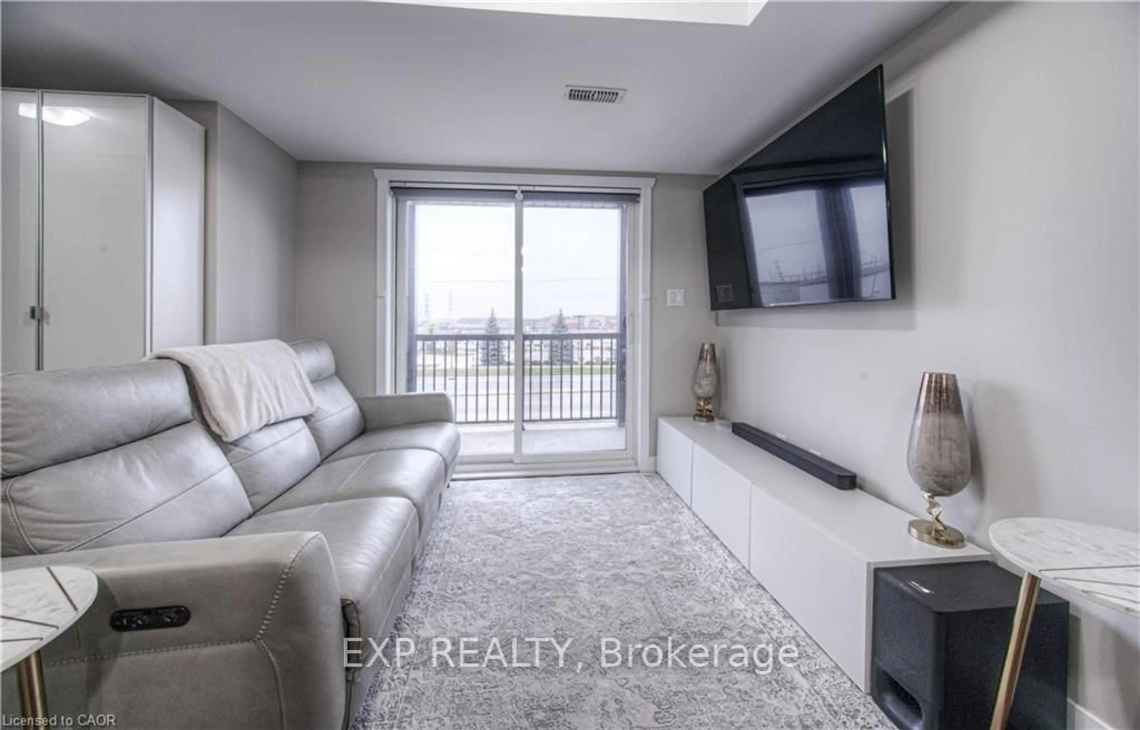 Living room with furniture, unknown for 1331 Countrystone Dr #A11, Kitchener Ontario N2T 2Z6