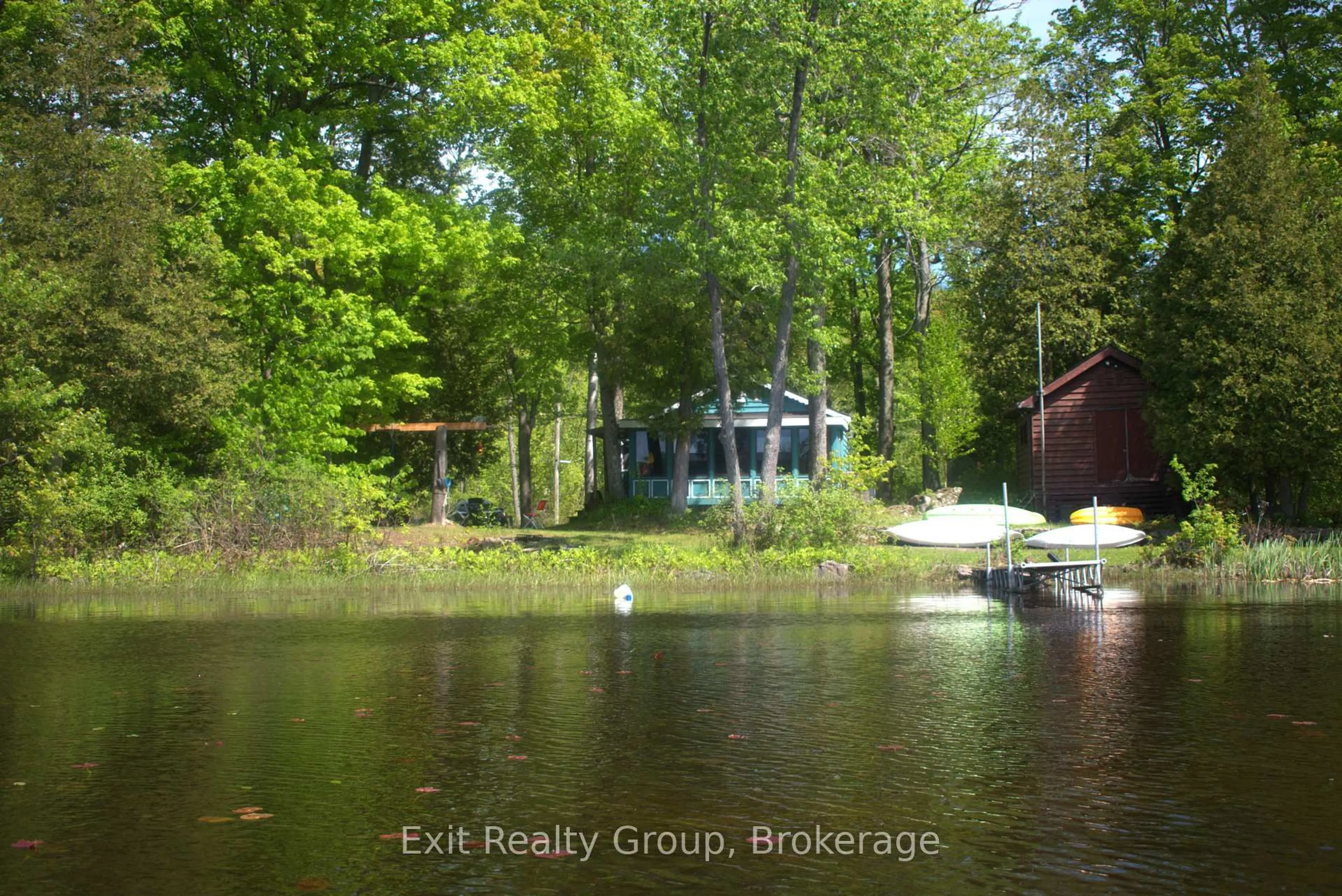 A pic from outside/outdoor area/front of a property/back of a property/a pic from drone, water/lake/river/ocean view for 559 C Pine Point Lane, Tweed Ontario K0K 3J0