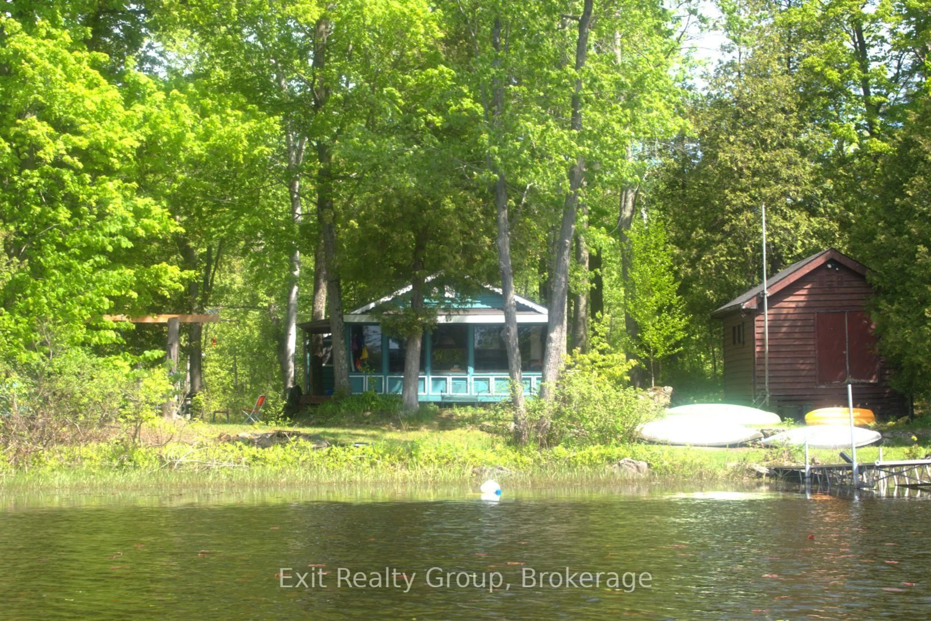A pic from outside/outdoor area/front of a property/back of a property/a pic from drone, water/lake/river/ocean view for 559 C Pine Point Lane, Tweed Ontario K0K 3J0