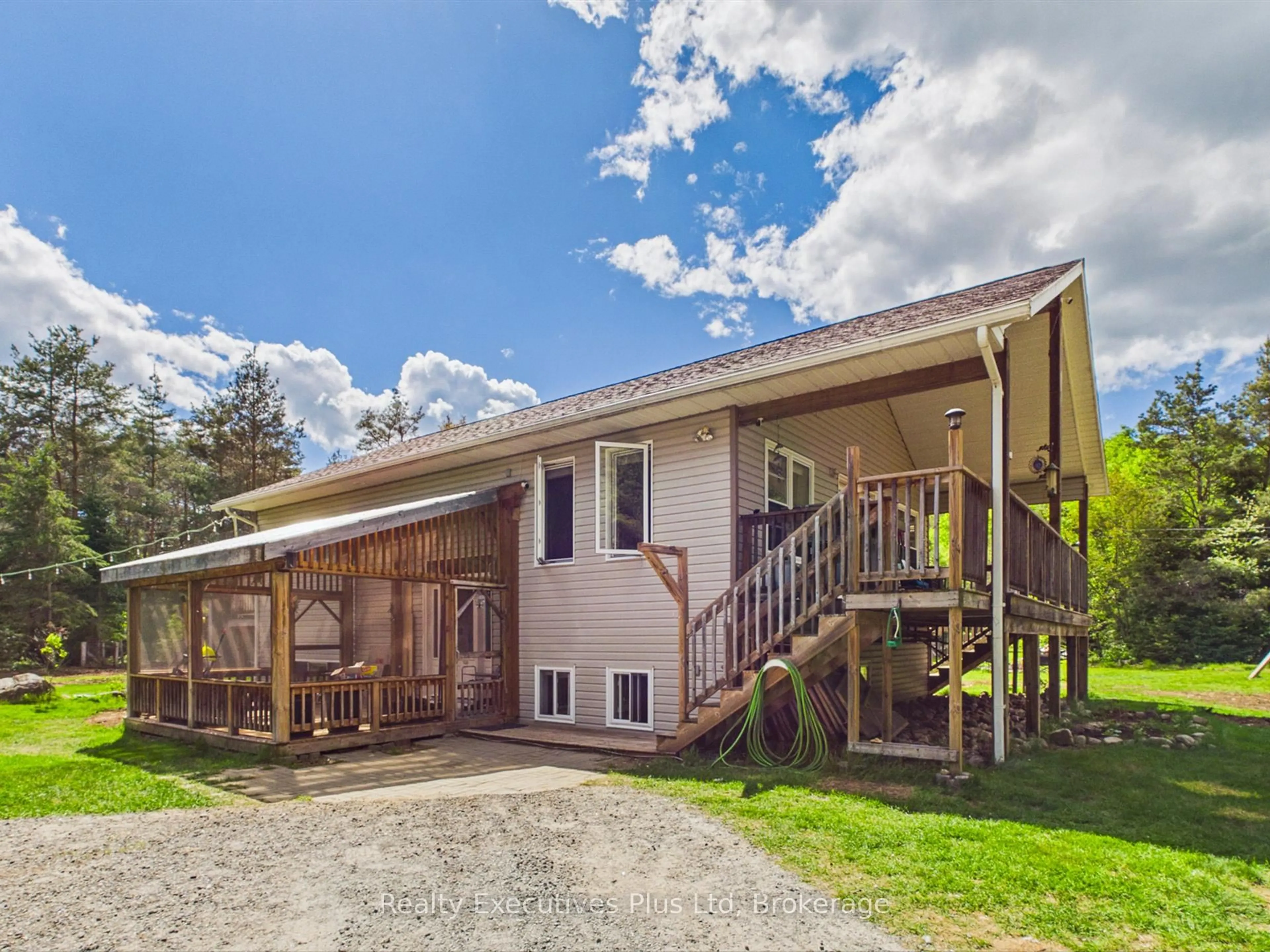 A pic from outside/outdoor area/front of a property/back of a property/a pic from drone, unknown for 235 Rock Point Rd, Kearney Ontario P0A 1M0