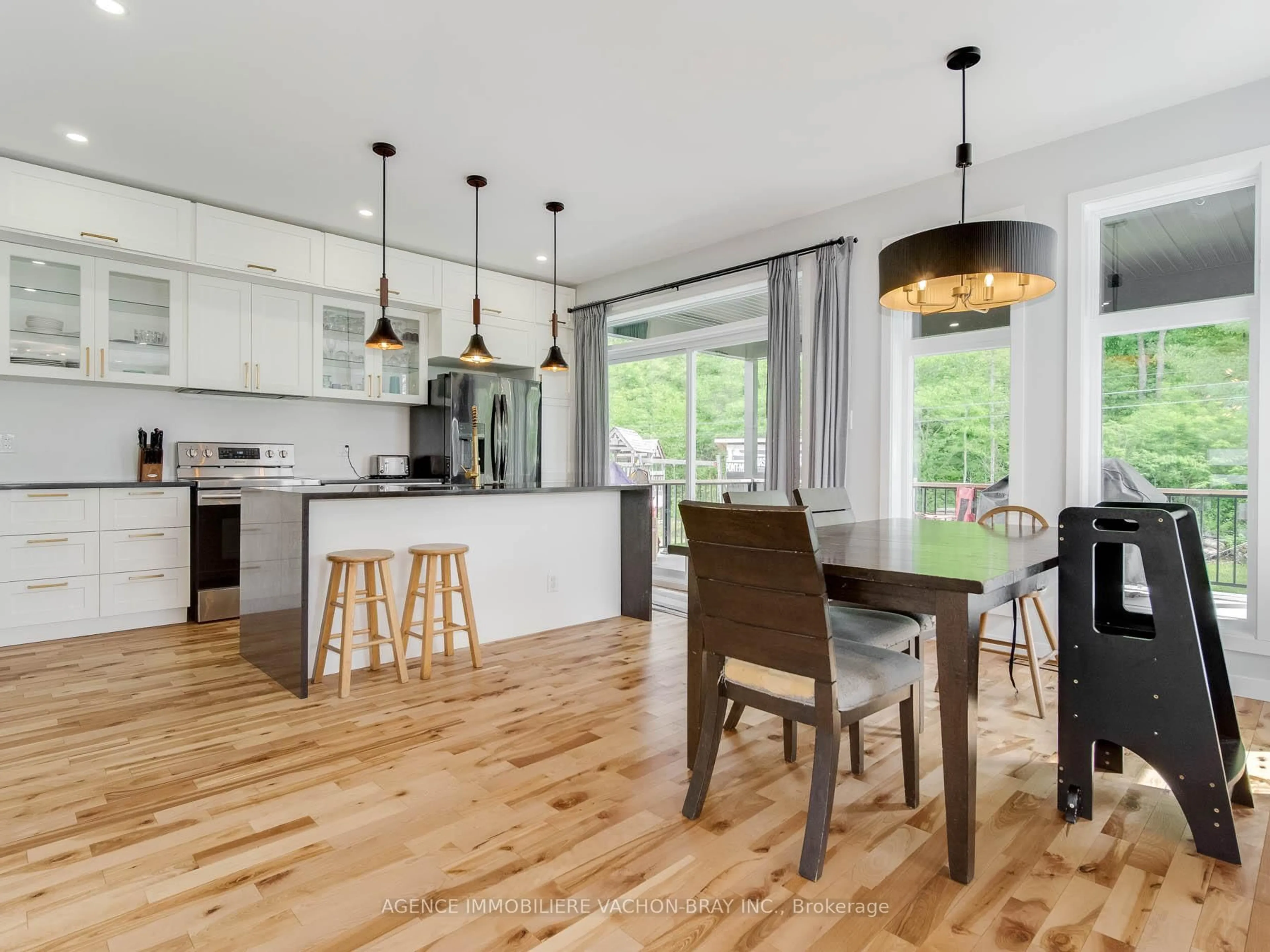 Open concept kitchen, wood/laminate floor for 3814 Lakeside Dr, South Glengarry Ontario K0C 1Z0