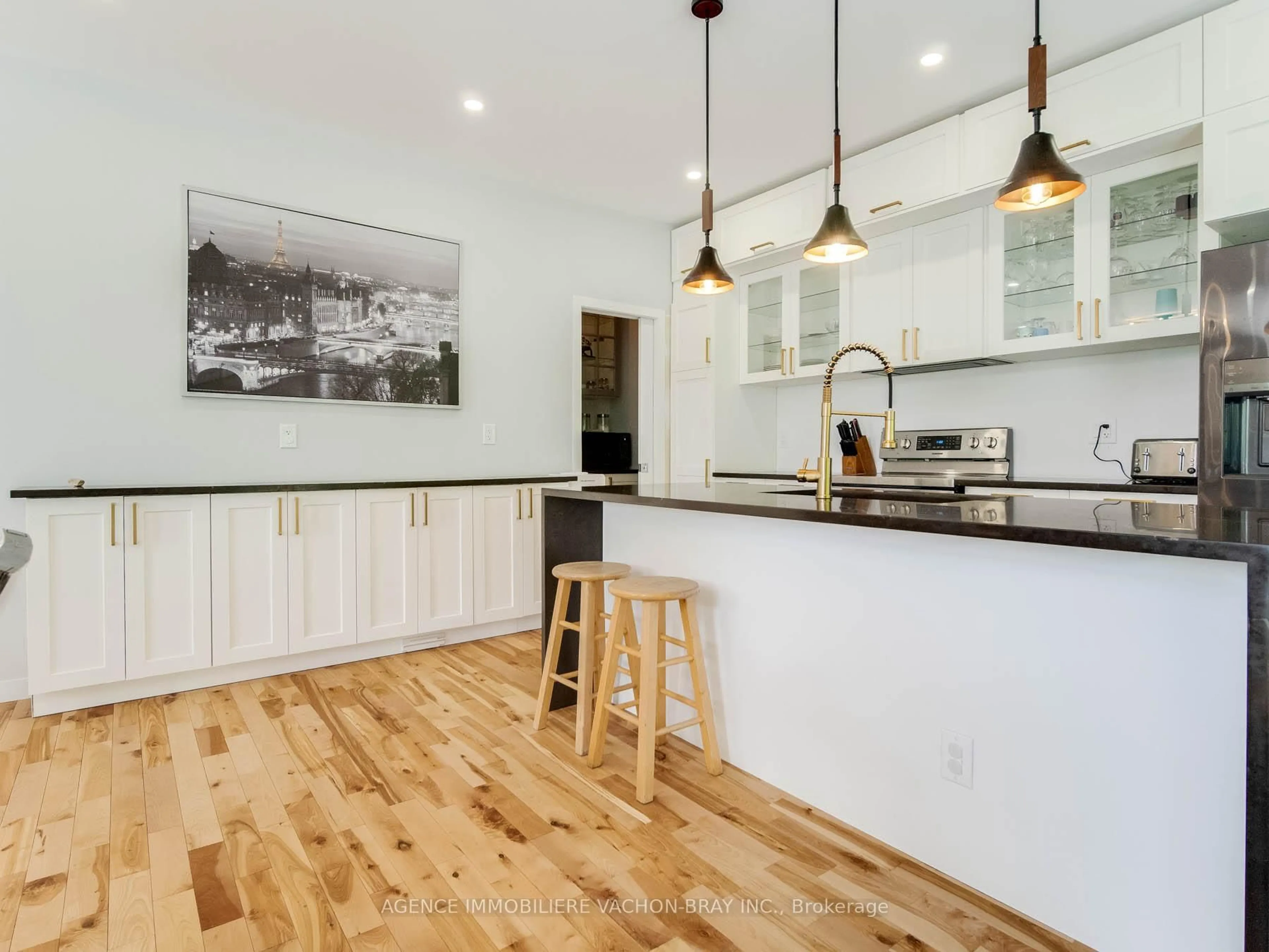 Open concept kitchen, wood/laminate floor for 3814 Lakeside Dr, South Glengarry Ontario K0C 1Z0
