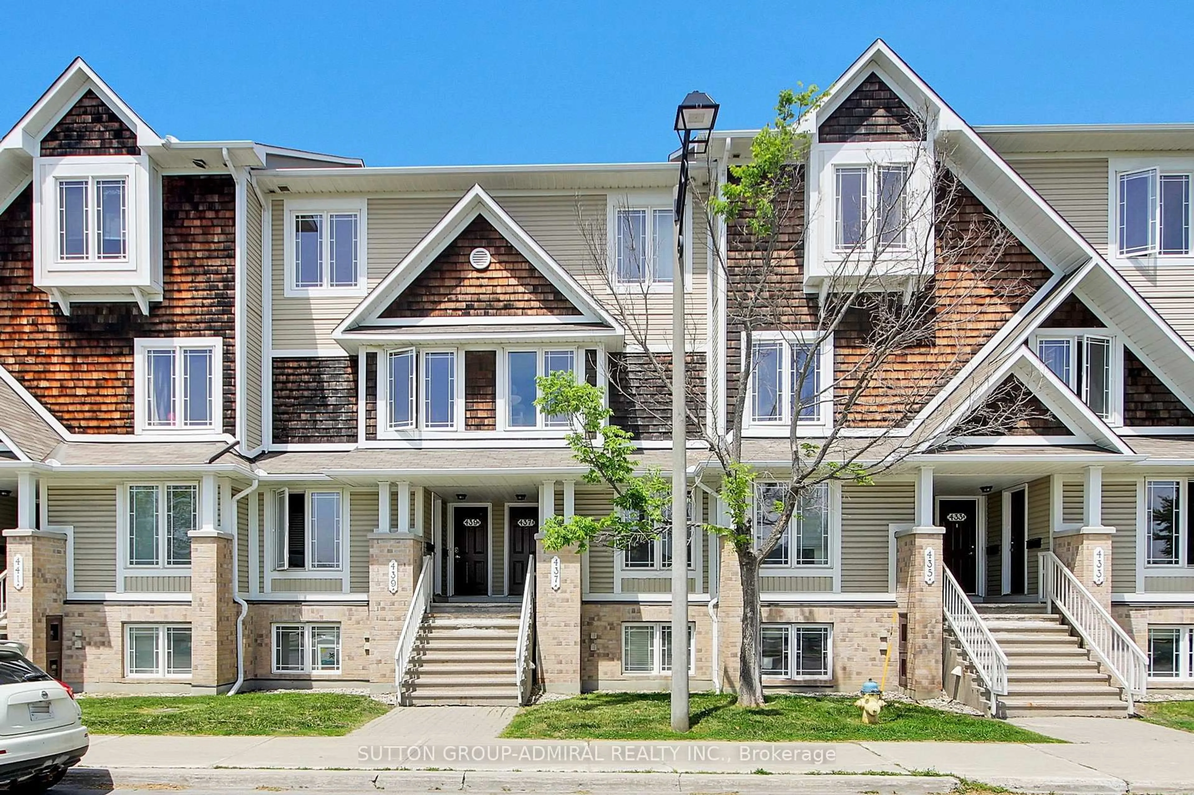 Home with brick exterior material, street for 439B Chapman Mills Dr, Ottawa Ontario K2J 5P4