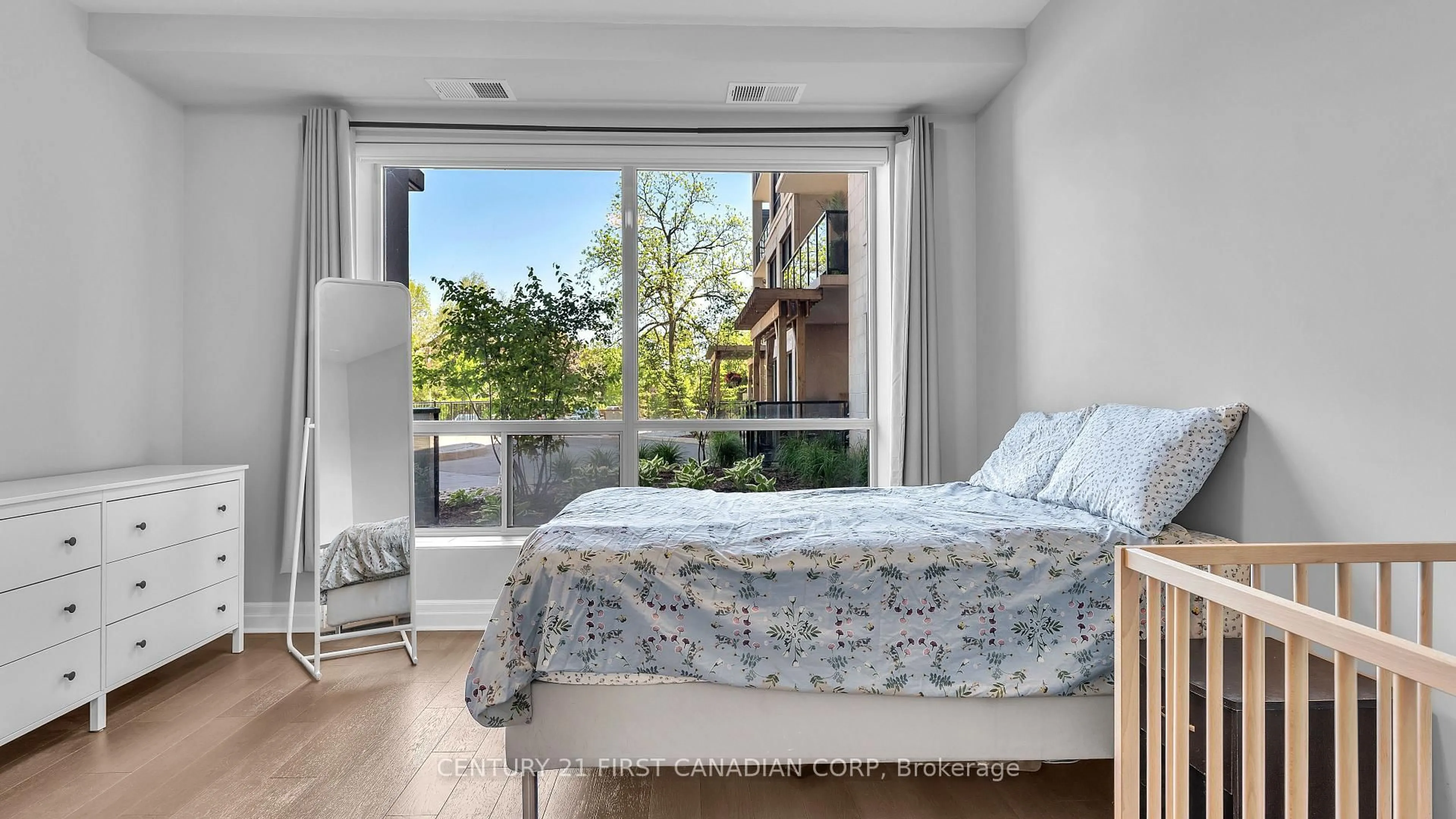 Bedroom with bed, wood/laminate floor for 1200 Commissioners Rd #118, London South Ontario N6K 1C7