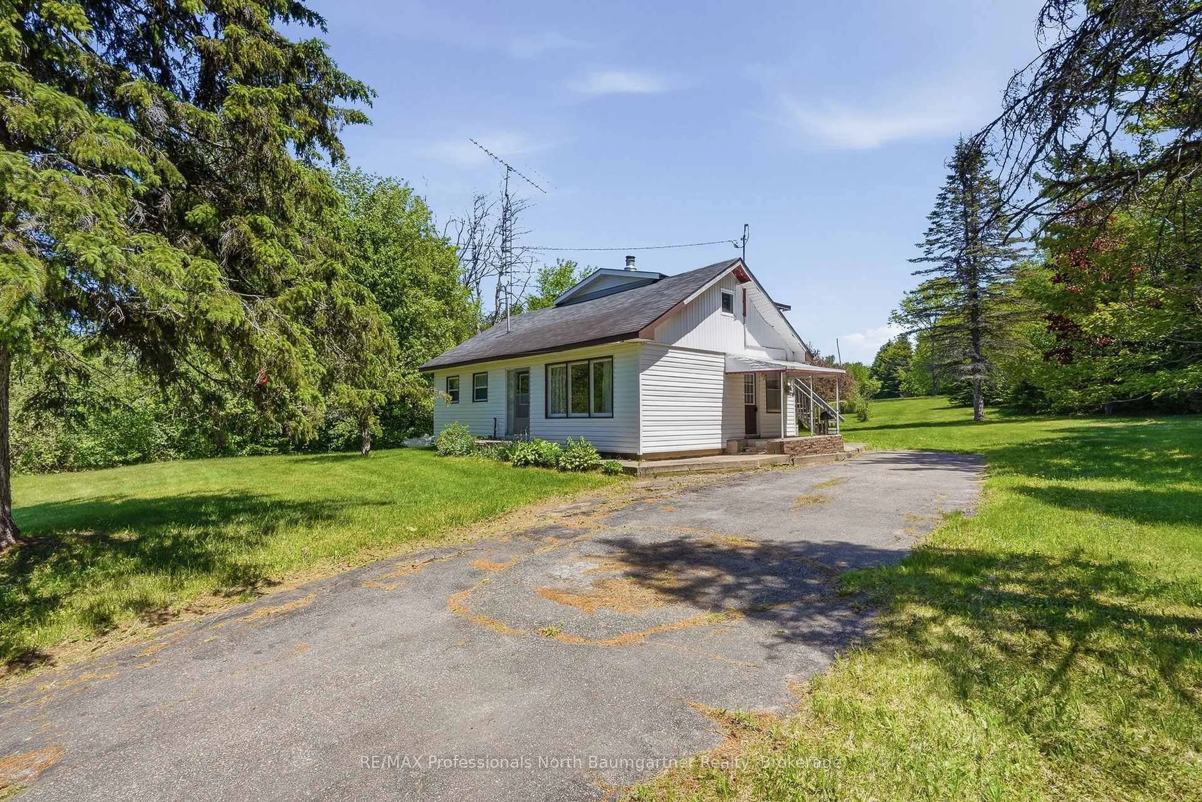 A pic from outside/outdoor area/front of a property/back of a property/a pic from drone, unknown for 6189 Loop Rd, Highlands East Ontario K0L 2A0