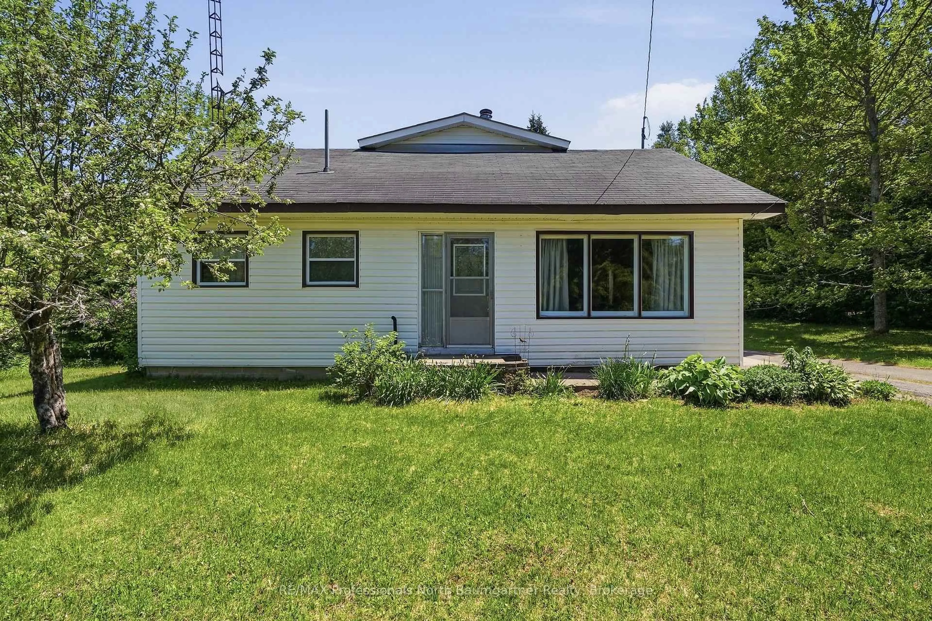 Home with vinyl exterior material, street for 6189 Loop Rd, Highlands East Ontario K0L 2A0