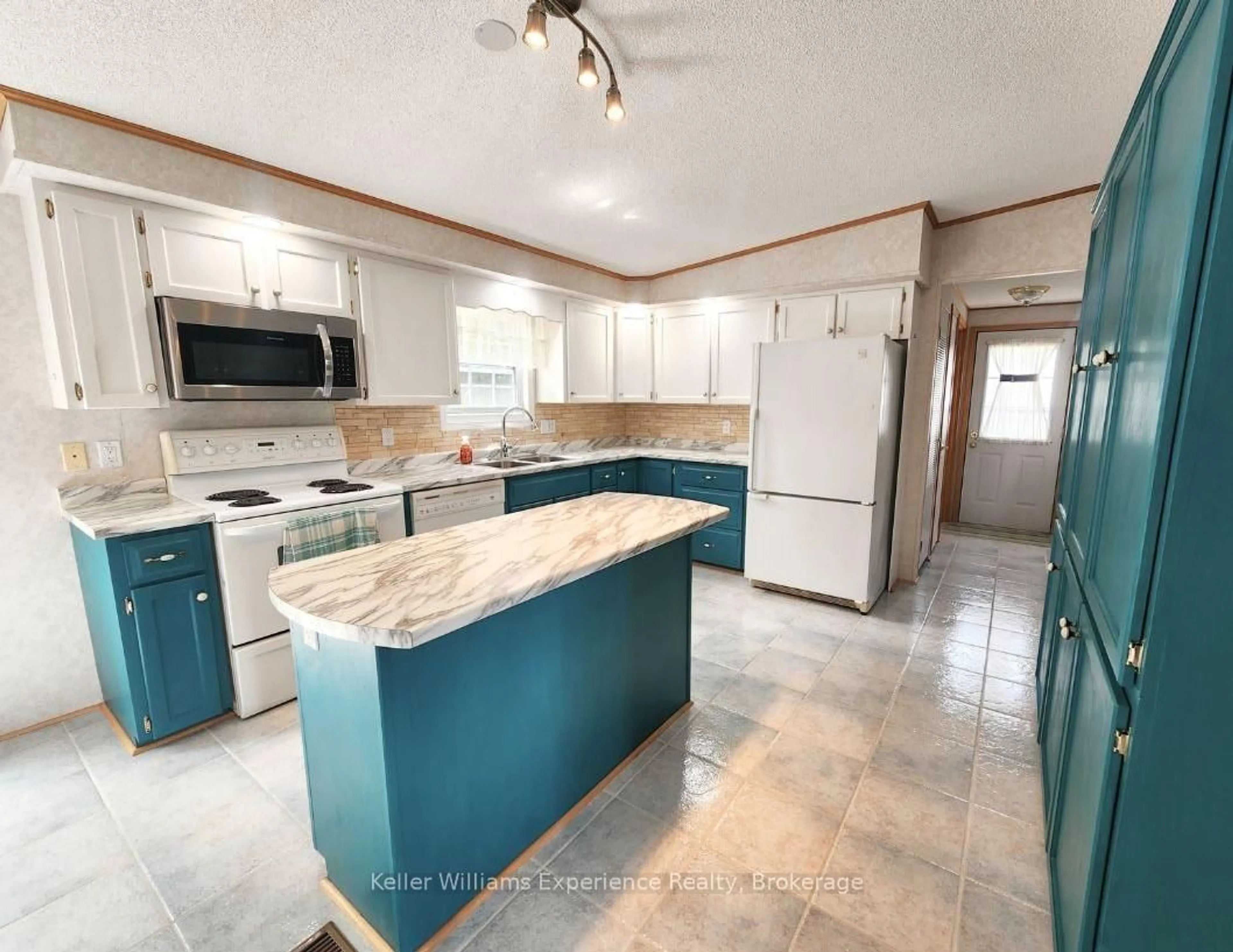 Open concept kitchen, ceramic/tile floor for 6512 Minto Line 12 #J-24, Minto Ontario N0G 1M0