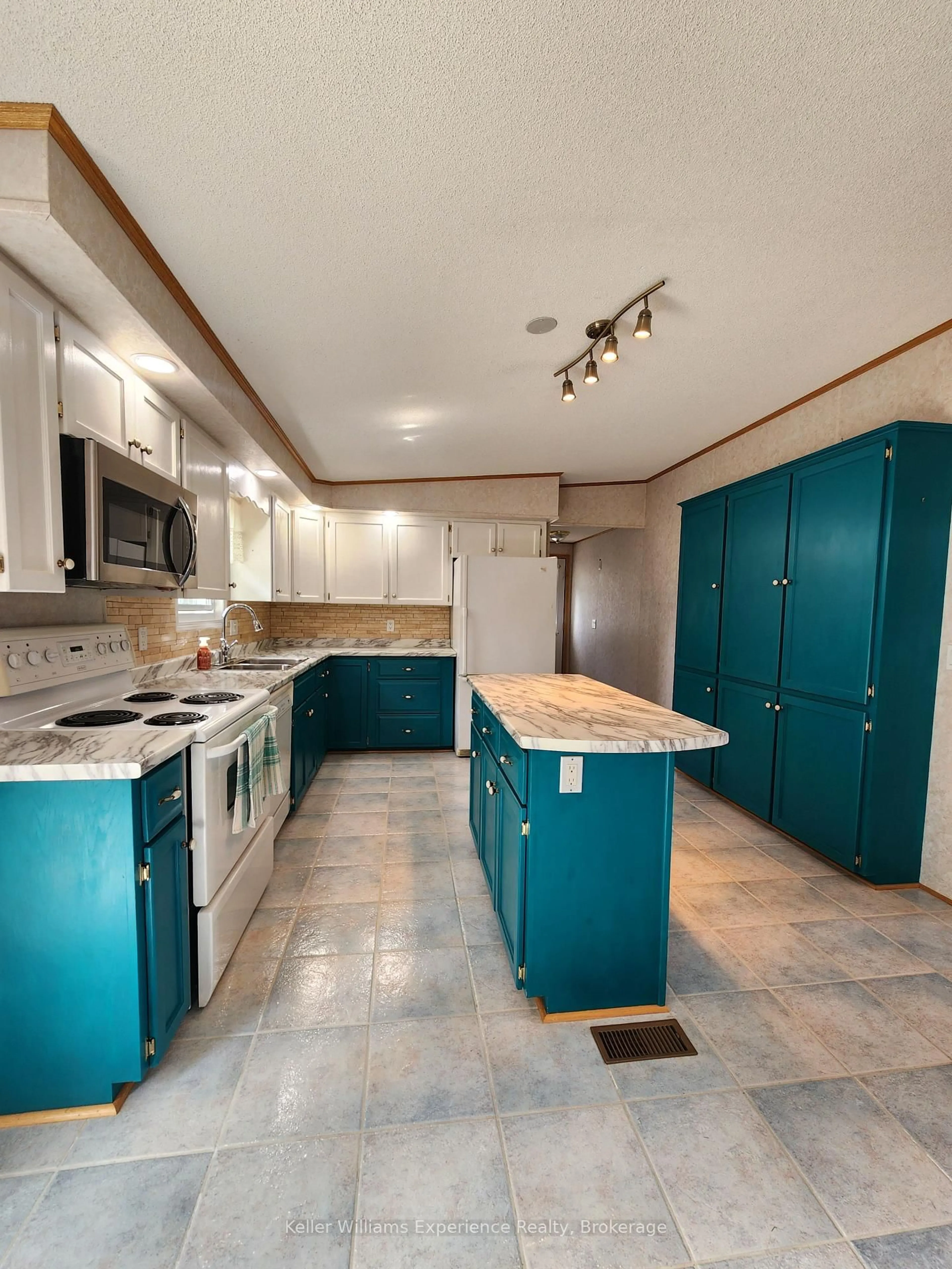 Open concept kitchen, ceramic/tile floor for 6512 Minto Line 12 #J-24, Minto Ontario N0G 1M0