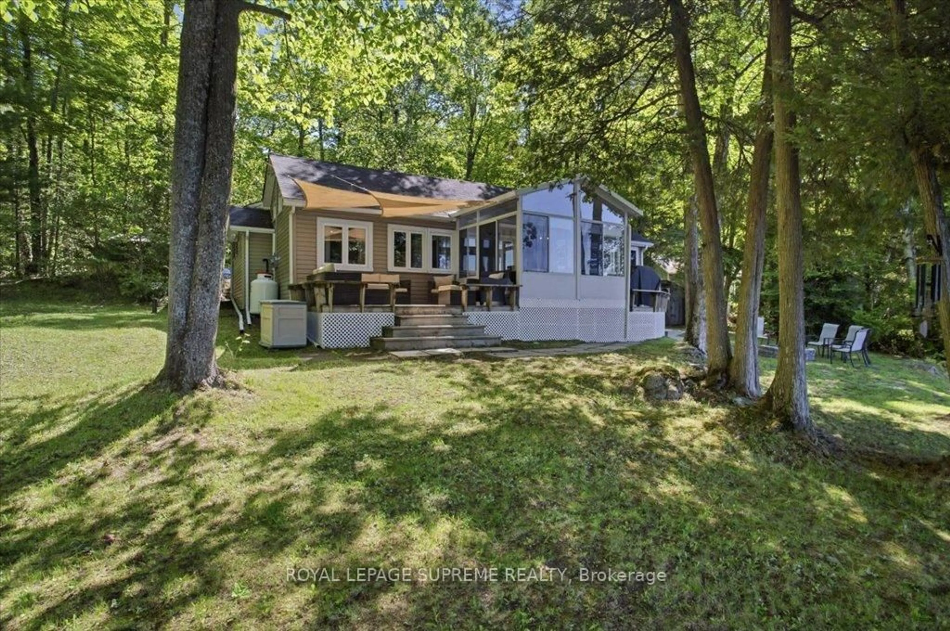 A pic from outside/outdoor area/front of a property/back of a property/a pic from drone, water/lake/river/ocean view for 115 Shadow Lake Rd 6 Rd, Kawartha Lakes Ontario K0M 1K0