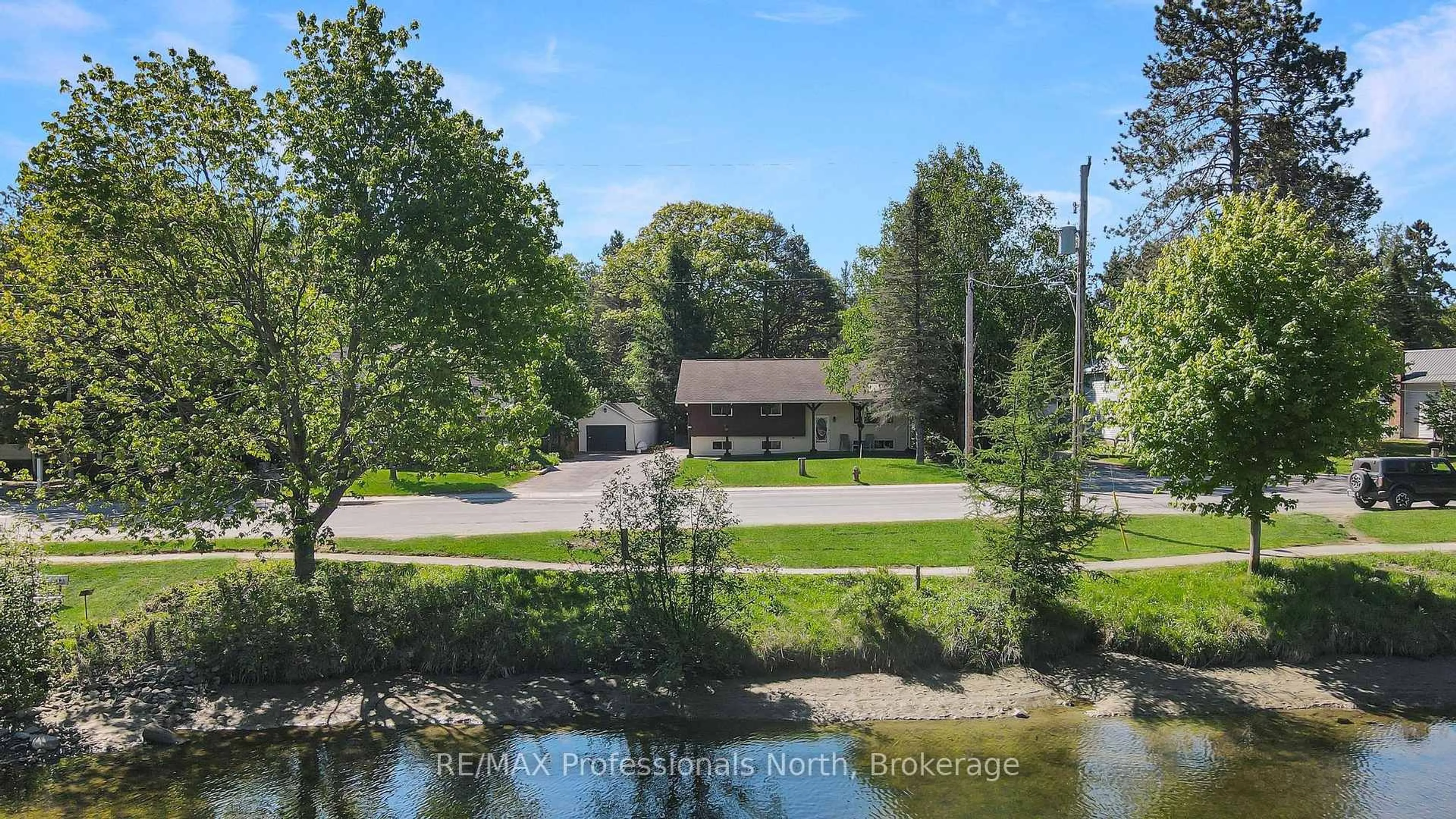 A pic from outside/outdoor area/front of a property/back of a property/a pic from drone, water/lake/river/ocean view for 52 South Water St, Minden Hills Ontario K0M 2K0