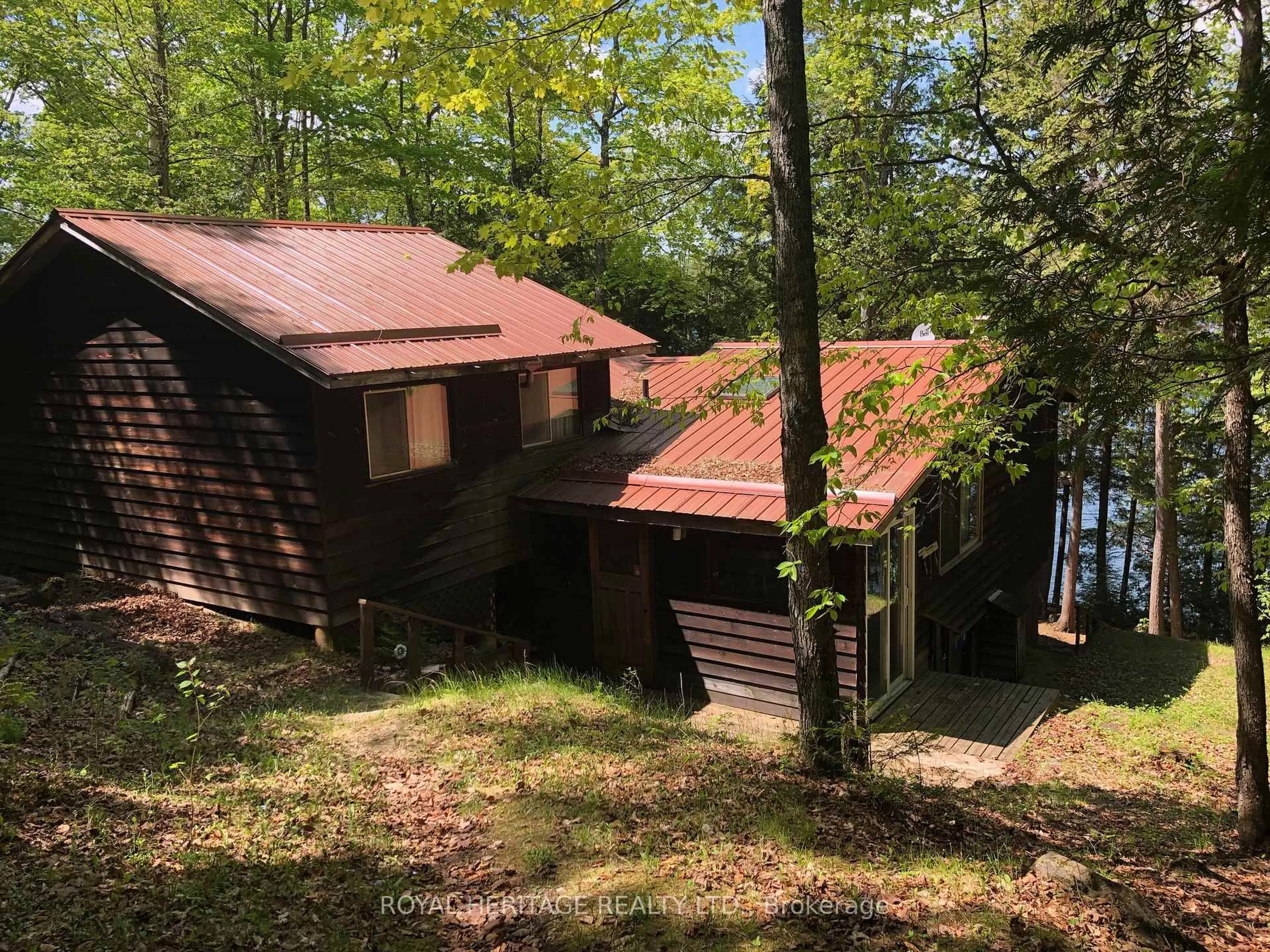 A pic from outside/outdoor area/front of a property/back of a property/a pic from drone, forest/trees view for 1160 Sunset Strip Lane, Ompah Ontario K0H 2J0