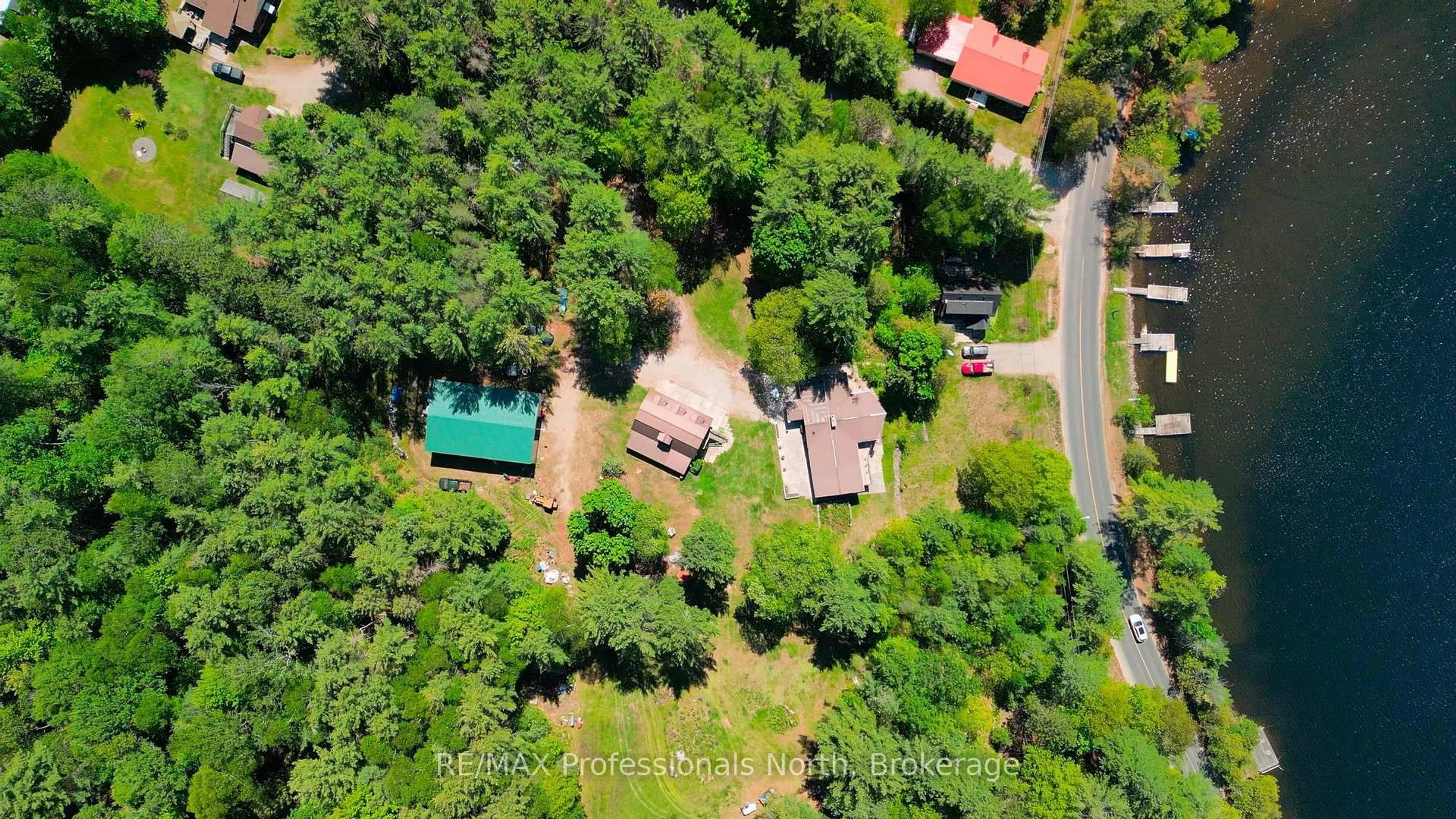 A pic from outside/outdoor area/front of a property/back of a property/a pic from drone, forest/trees view for 1015 Kelson Rd, Minden Hills Ontario K0M 2K0