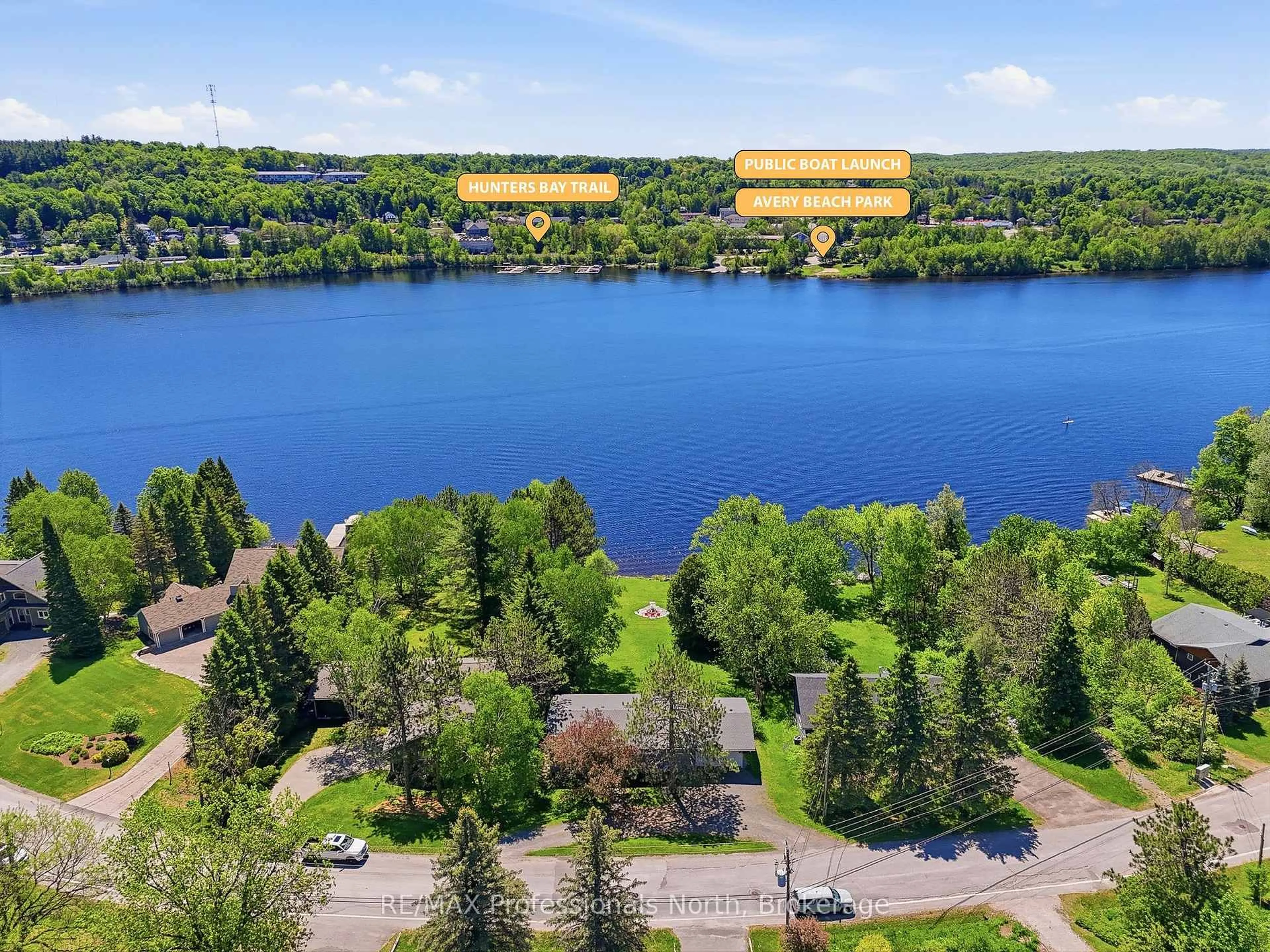A pic from outside/outdoor area/front of a property/back of a property/a pic from drone, water/lake/river/ocean view for 155 Hunters Bay Dr, Huntsville Ontario P1H 1M9