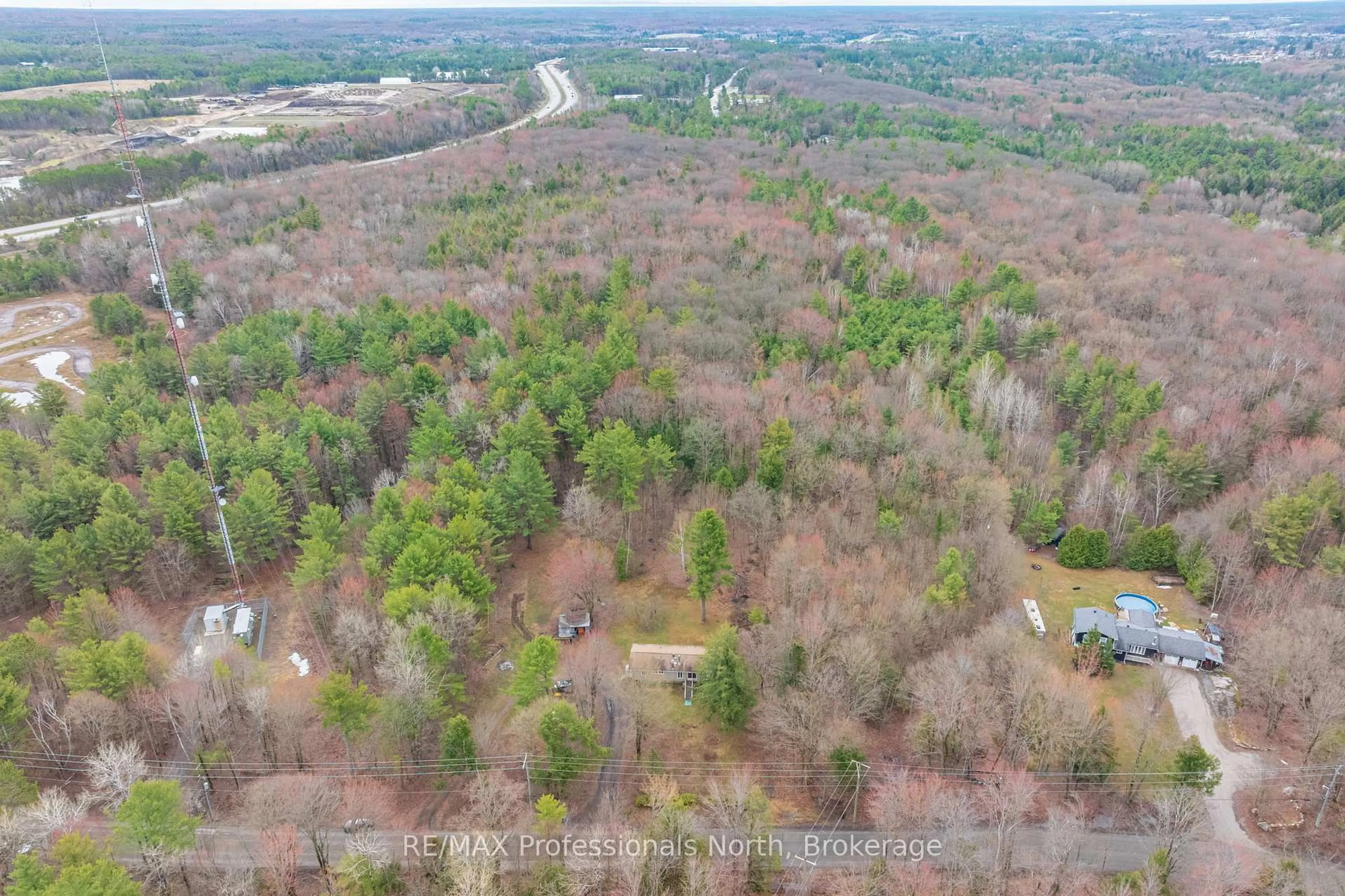 A pic from outside/outdoor area/front of a property/back of a property/a pic from drone, forest/trees view for 1056 Kirk Line, Bracebridge Ontario P1L 1W9