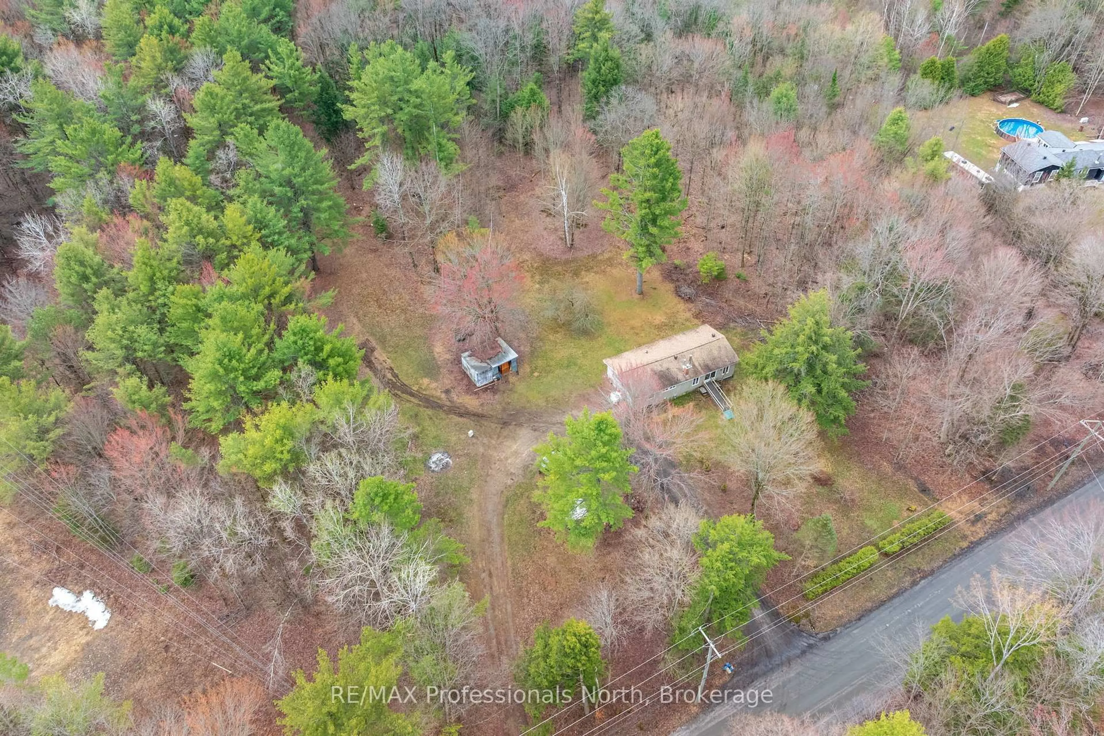 A pic from outside/outdoor area/front of a property/back of a property/a pic from drone, forest/trees view for 1056 Kirk Line, Bracebridge Ontario P1L 1W9