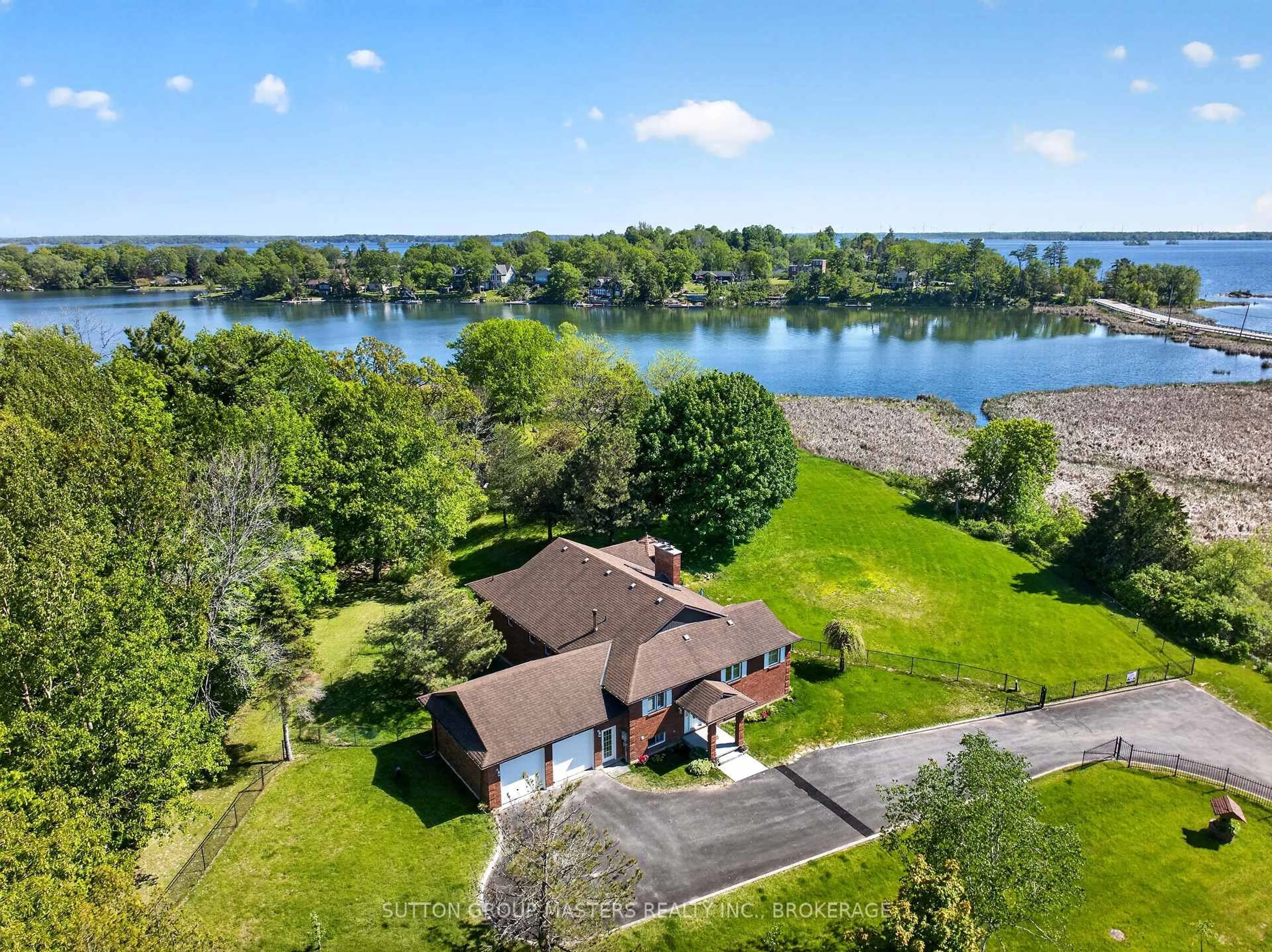 A pic from outside/outdoor area/front of a property/back of a property/a pic from drone, water/lake/river/ocean view for 911 School Rd, Kingston Ontario K7L 4V1