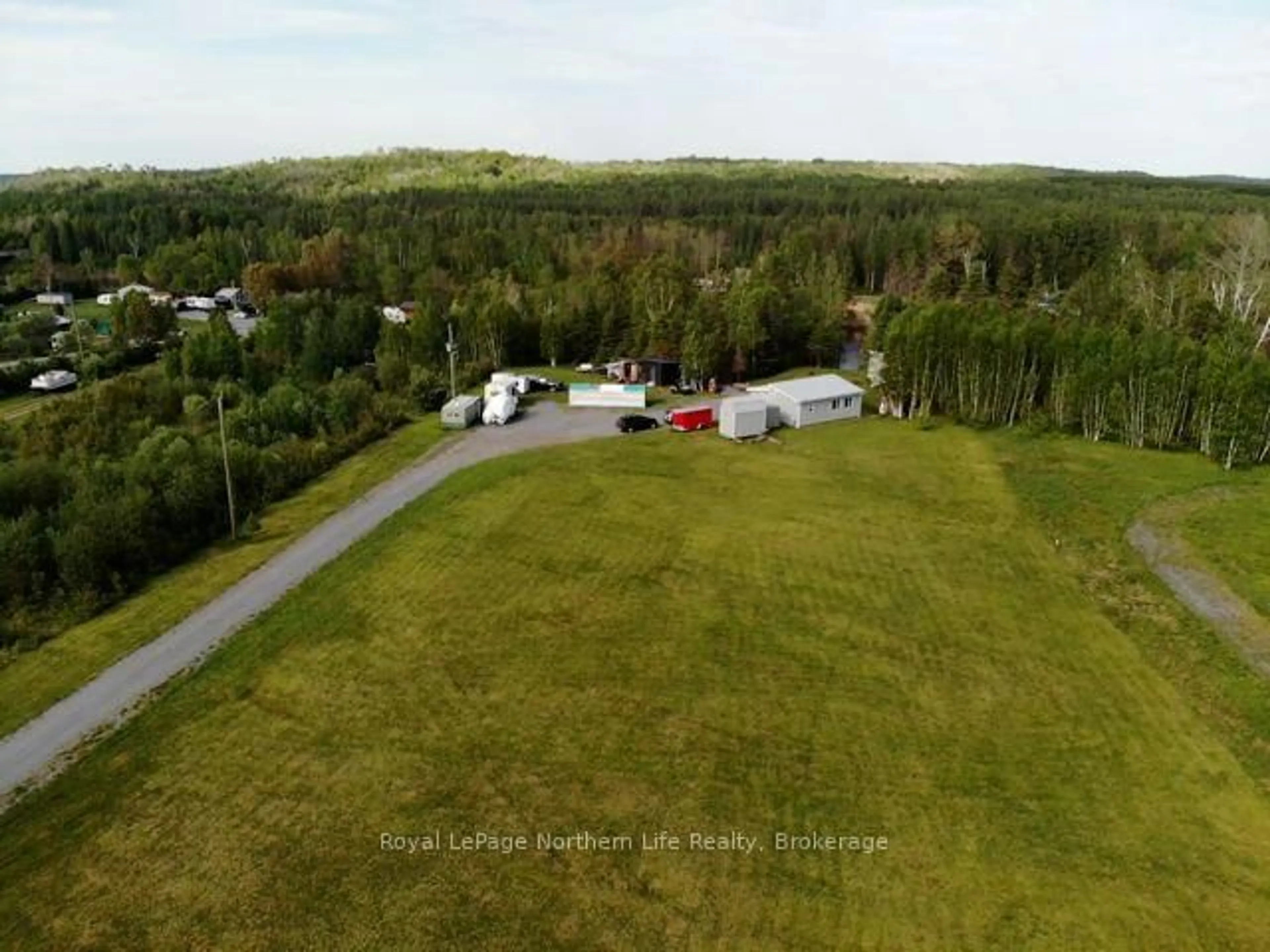 A pic from outside/outdoor area/front of a property/back of a property/a pic from drone, forest/trees view for 49 Nicholson Rd, West Nipissing Ontario P0H 2C0