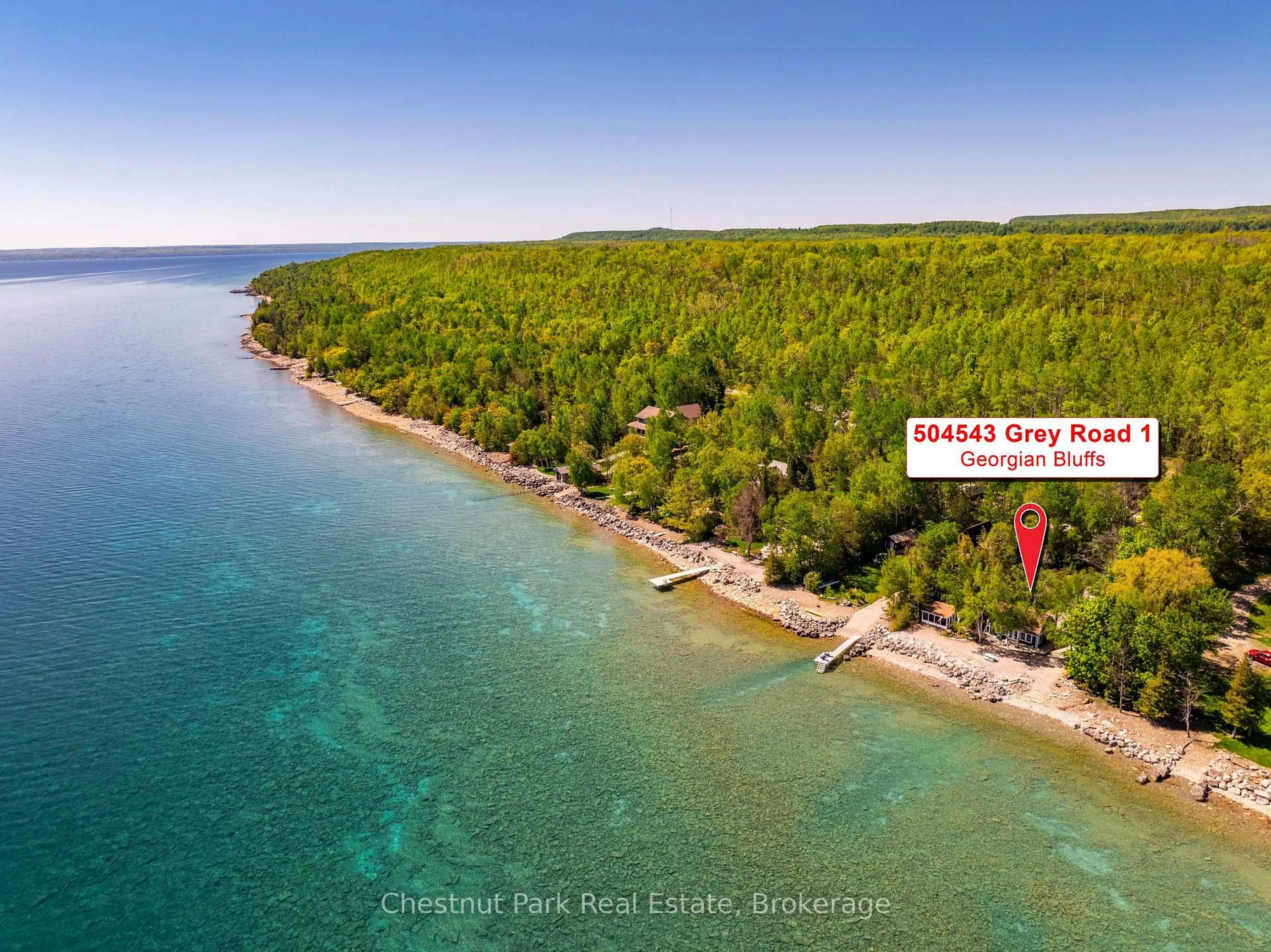A pic from outside/outdoor area/front of a property/back of a property/a pic from drone, water/lake/river/ocean view for 504543 Grey Road 1, Georgian Bluffs Ontario N0H 2T0
