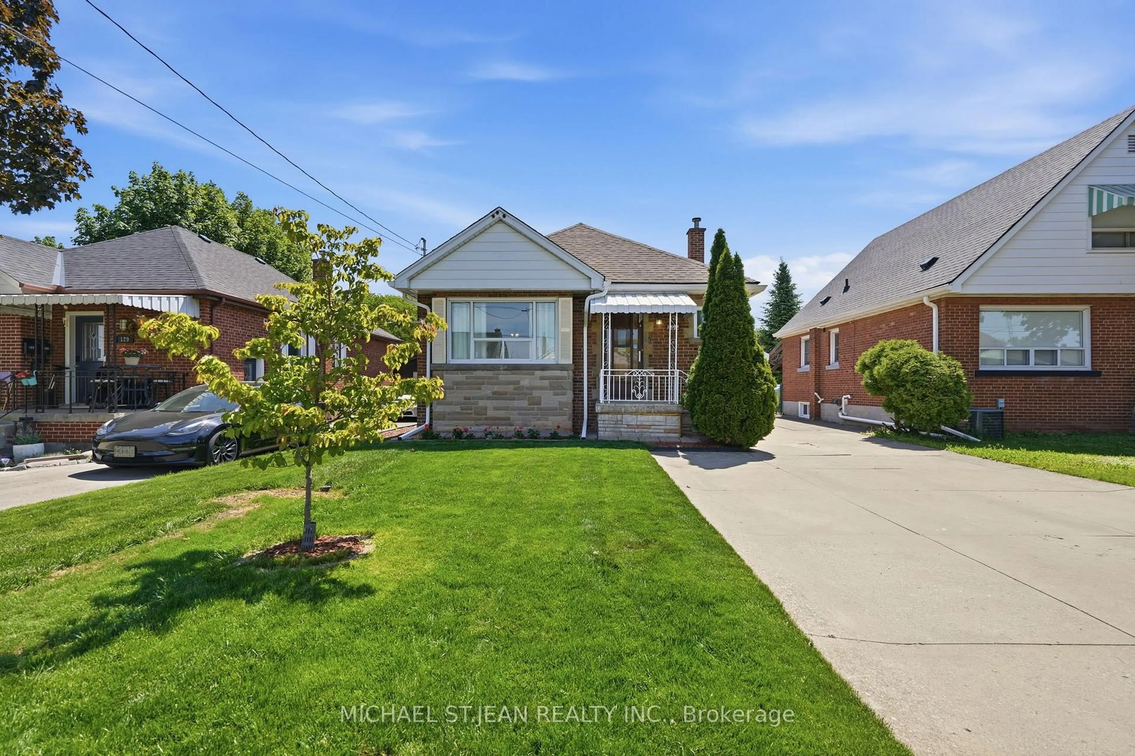 Home with brick exterior material, street for 133 Beland Ave, Hamilton Ontario L8K 3T5