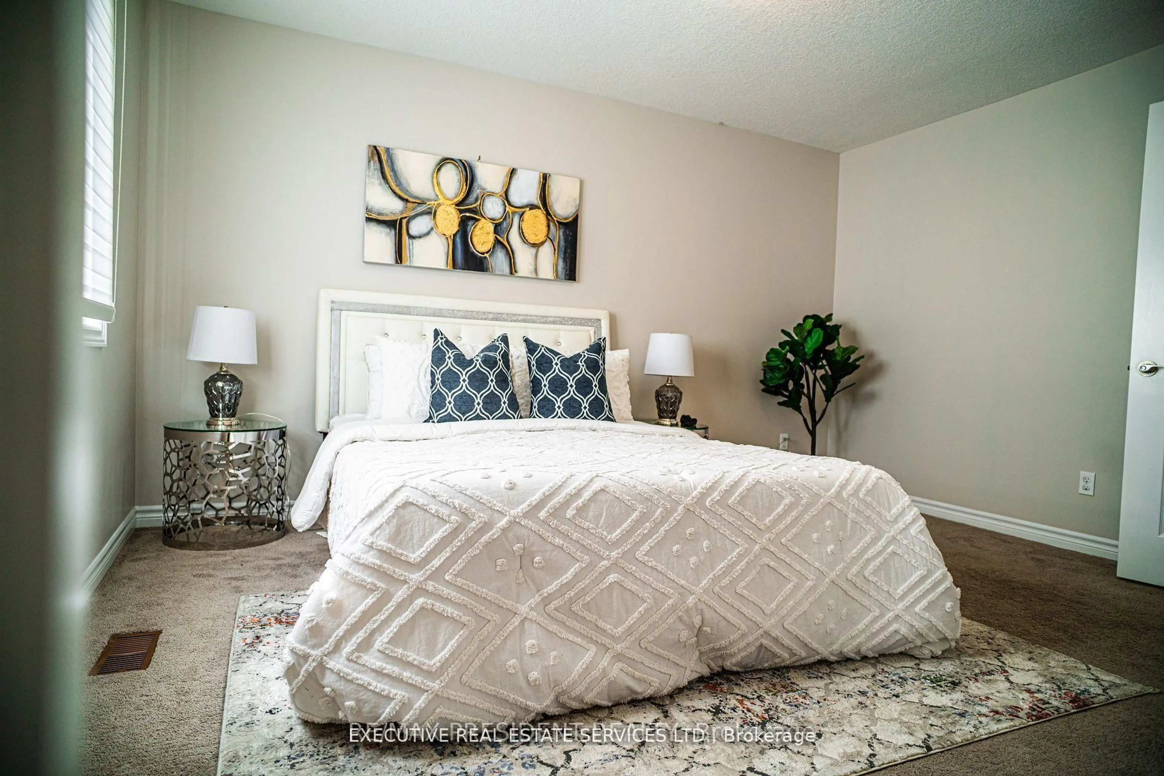 Bedroom with bed, carpet floor for 700 Spitfire St, Woodstock Ontario N4T 0B1