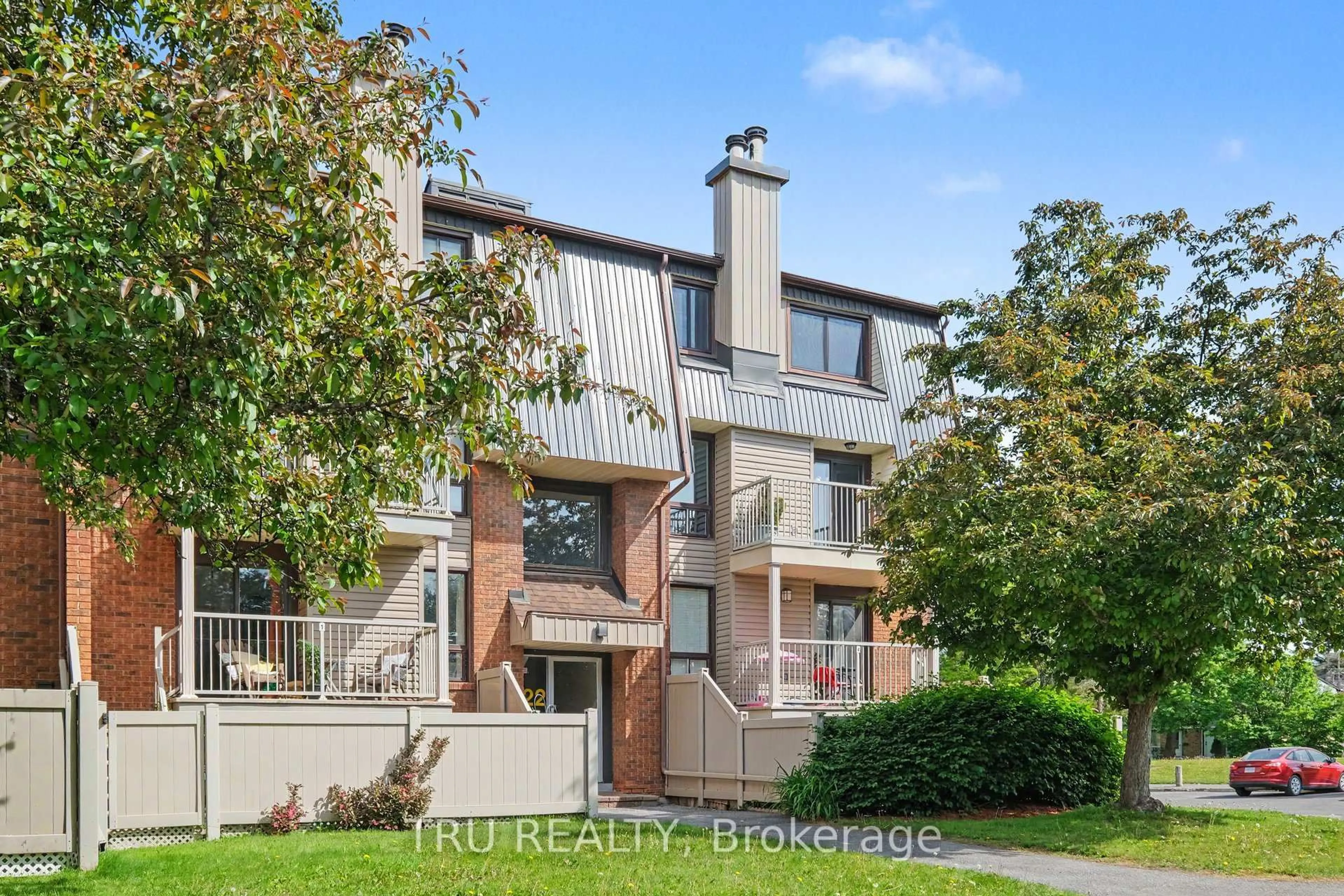 Home with brick exterior material, street for 22 Sweetbriar Circ #8, Ottawa Ontario K2J 2K4