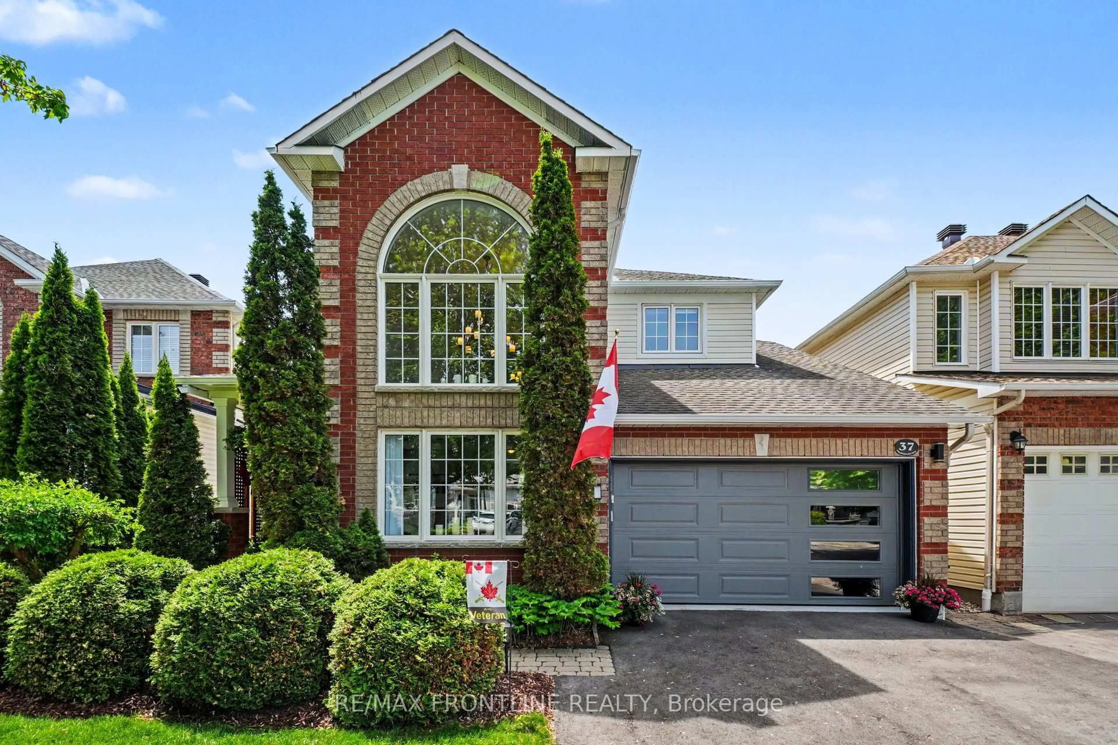 Home with brick exterior material, street for 37 Calderwood Way, Ottawa Ontario K2J 5L9
