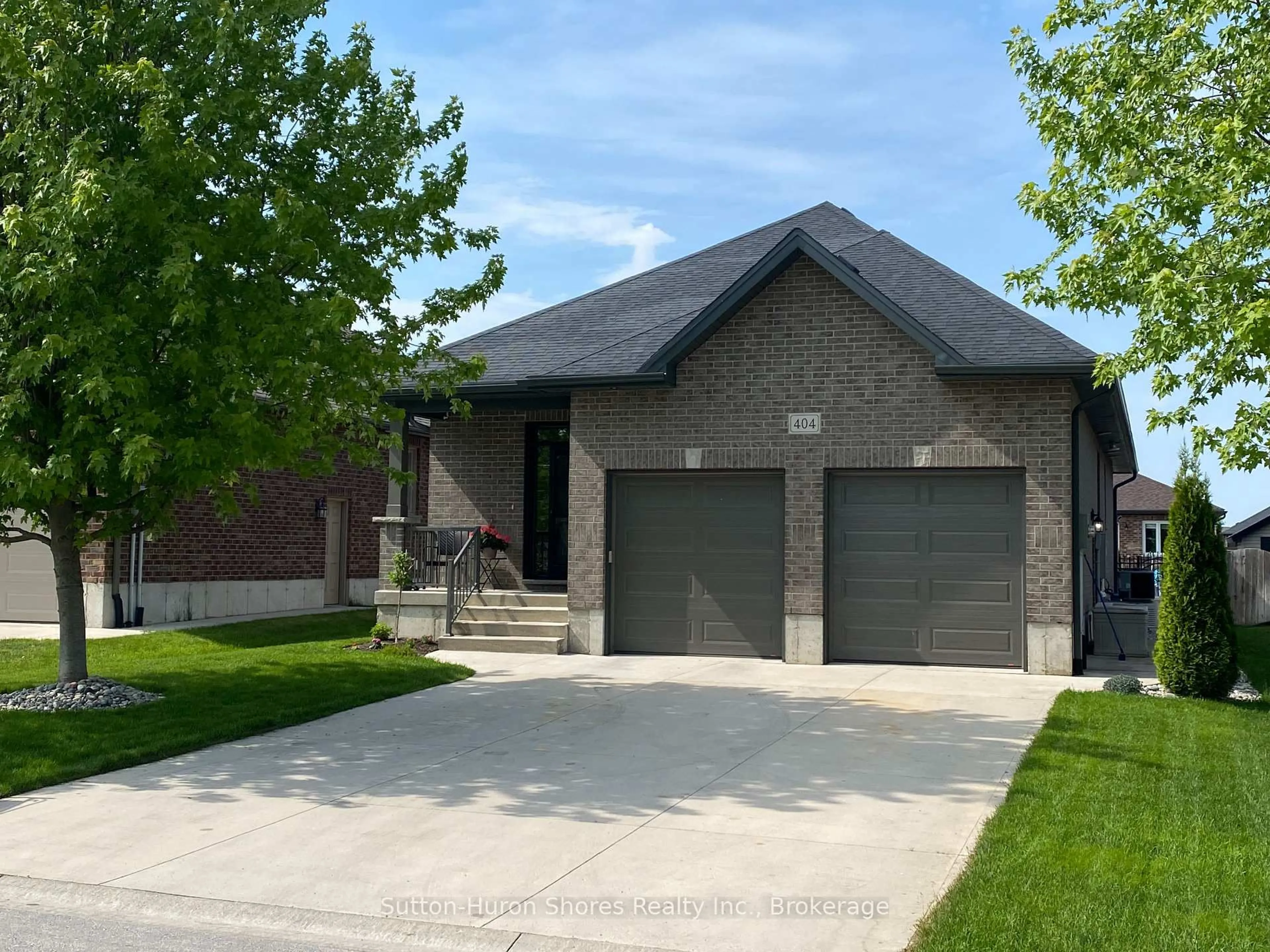 Home with brick exterior material, street for 404 Devonshire Rd, Saugeen Shores Ontario N0H 2C3