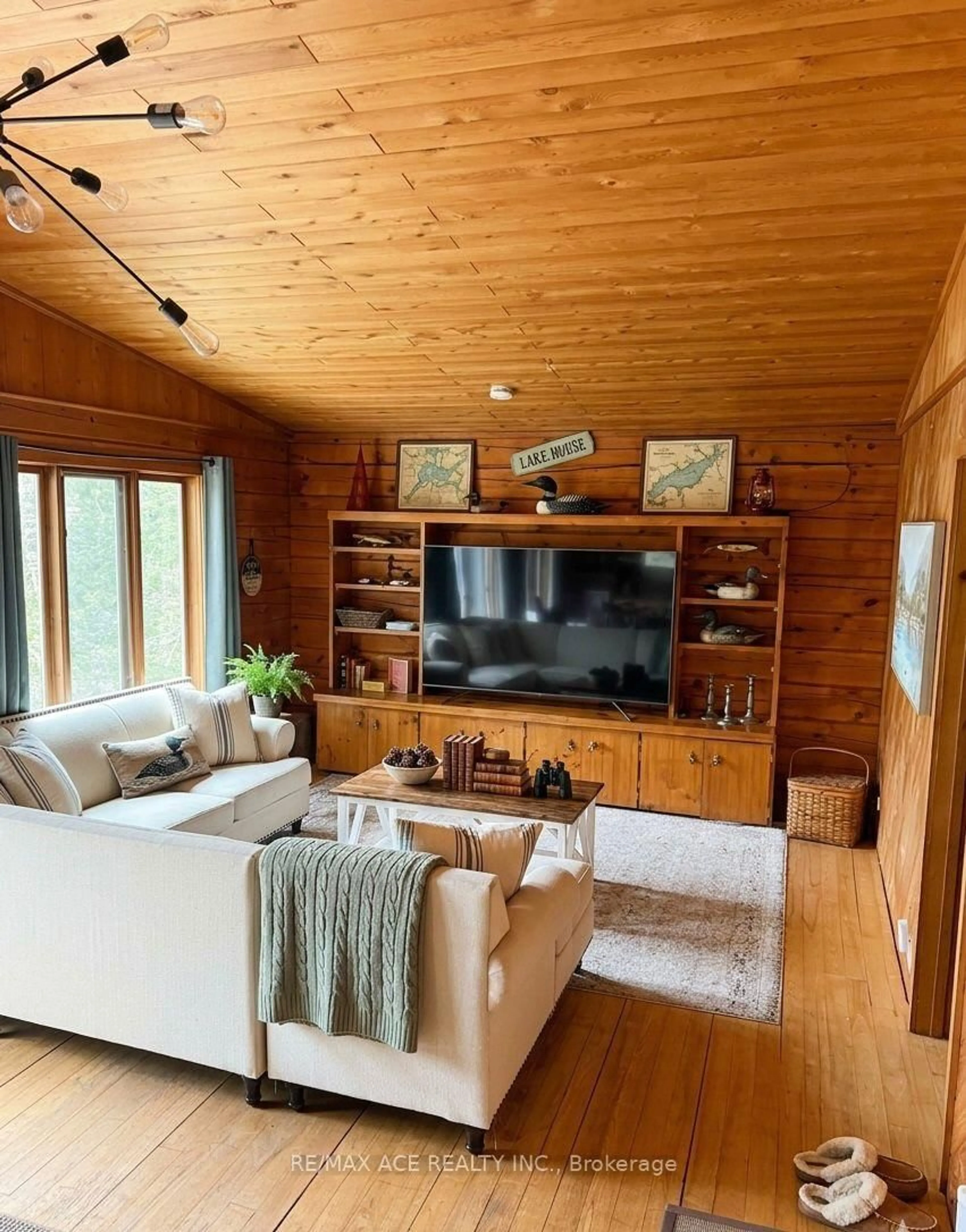 Living room with furniture, wood/laminate floor for 253 Faradale Dr, Bancroft Ontario K0L 1C0