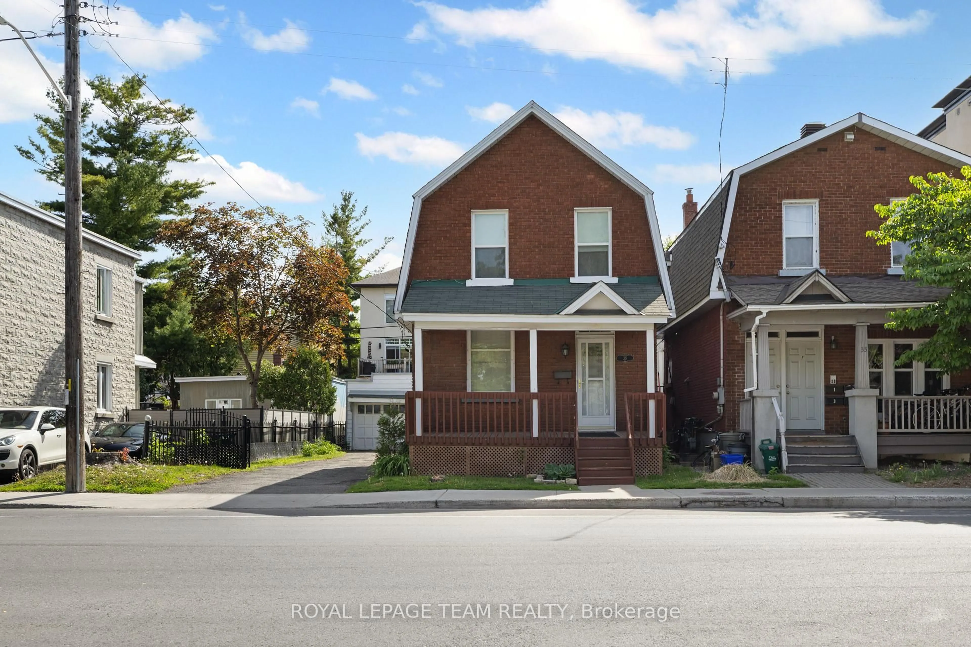 Home with brick exterior material, street for 35 Springfield Rd, Ottawa Ontario K1M 1C8